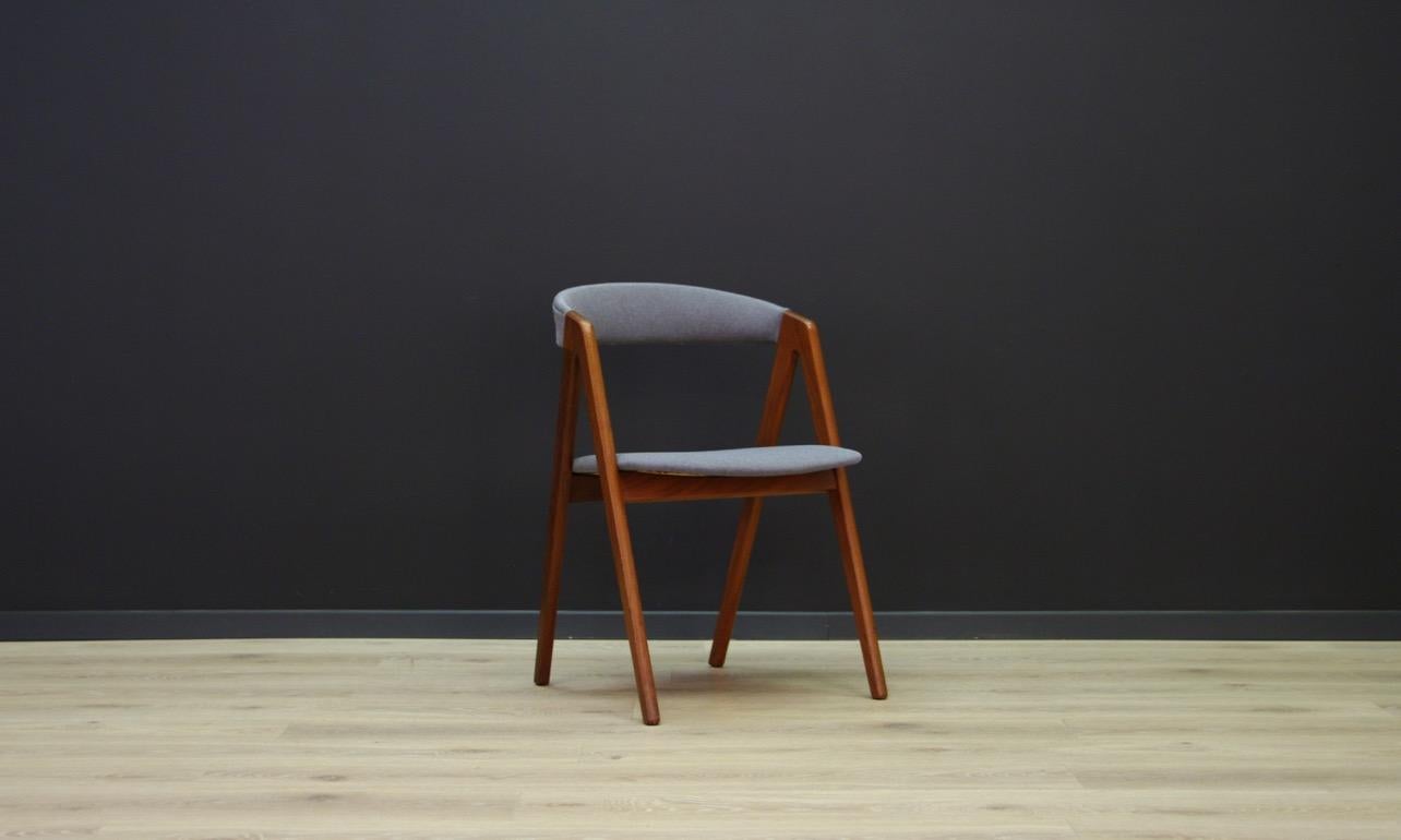 Stylish armchair from the 1960s-1970s, a beautiful minimalist form - Scandinavian design. The seat is covered with a new upholstery (color - grey). The construction is made of teak wood. Preserved in good condition - directly for use.

Dimensions:
