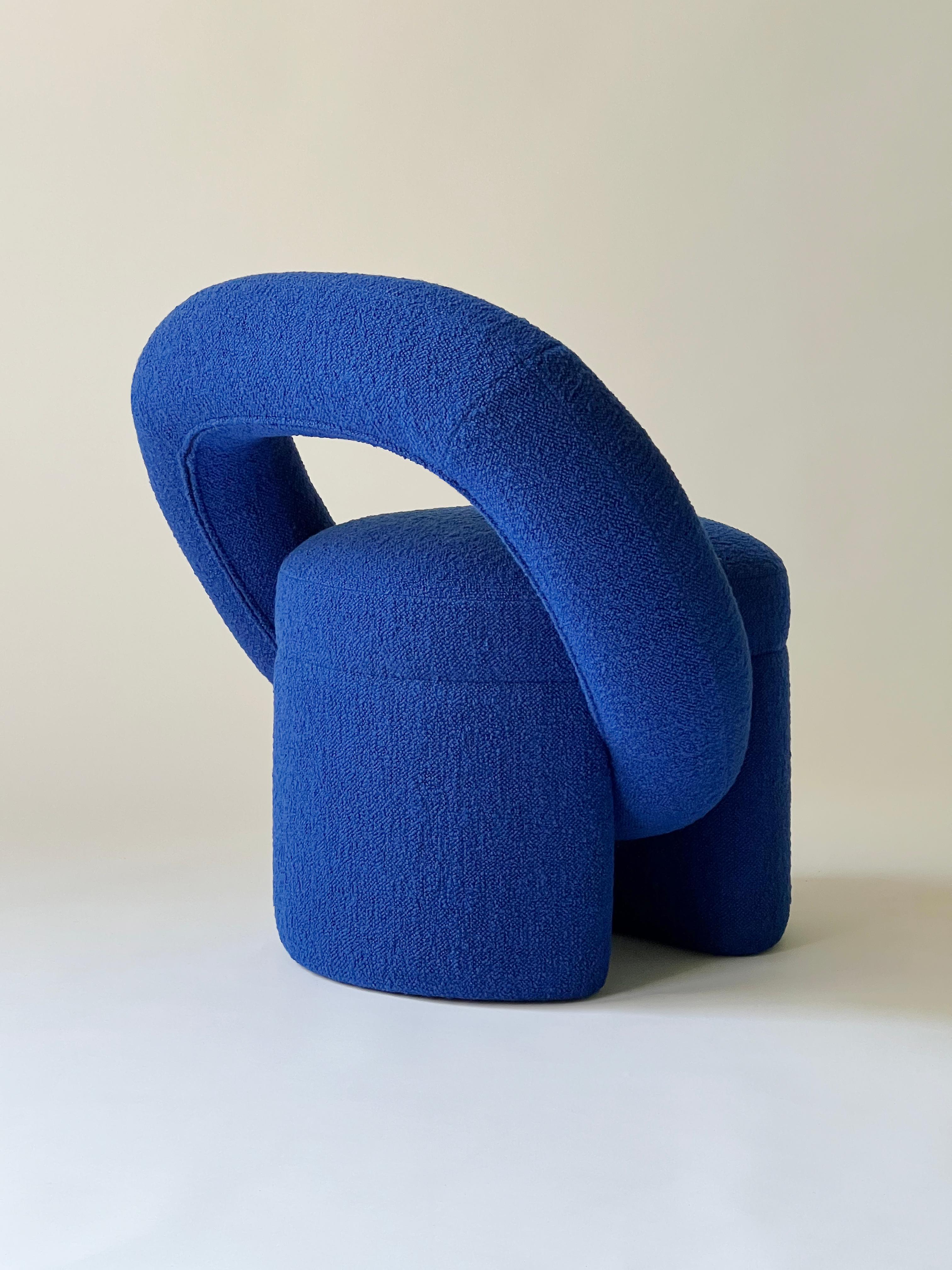 “PLAY” armchair has an unusual shape that was assembled from several geometric elements. The bagel-shaped detail serves the back of the chair.
Handcrafted in Ukraine, this armchair embodies the perfect blend of comfort and style. Its sleek design