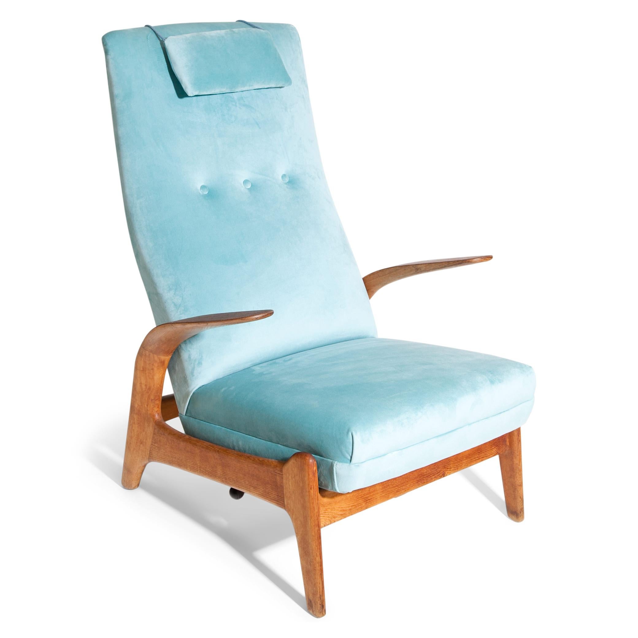 Lounge chair by Rolf Rastad & Adolf Relling on a smooth wooden base with short armrests. The seat was reupholstered with a light blue velvet fabric and can be tilted.