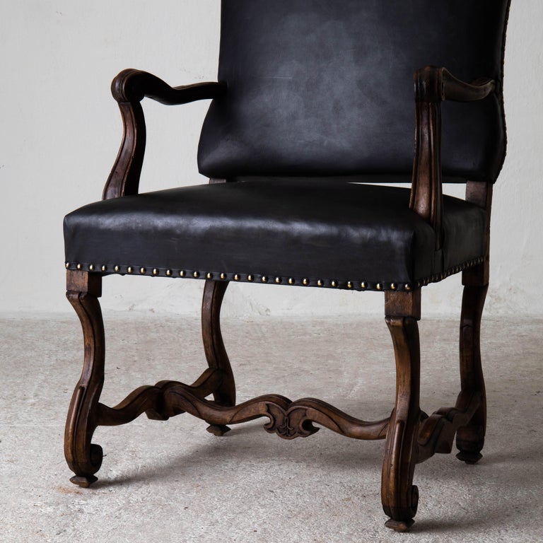 Armchair Swedish Black Baroque period 1650-1750, Sweden. An armchair made during the Baroque period in Sweden 1650-1750. Frame made in dark stained beech or birch. Reupholstered in a waxed vintage leather. Finished with brass nailheads.
 
  