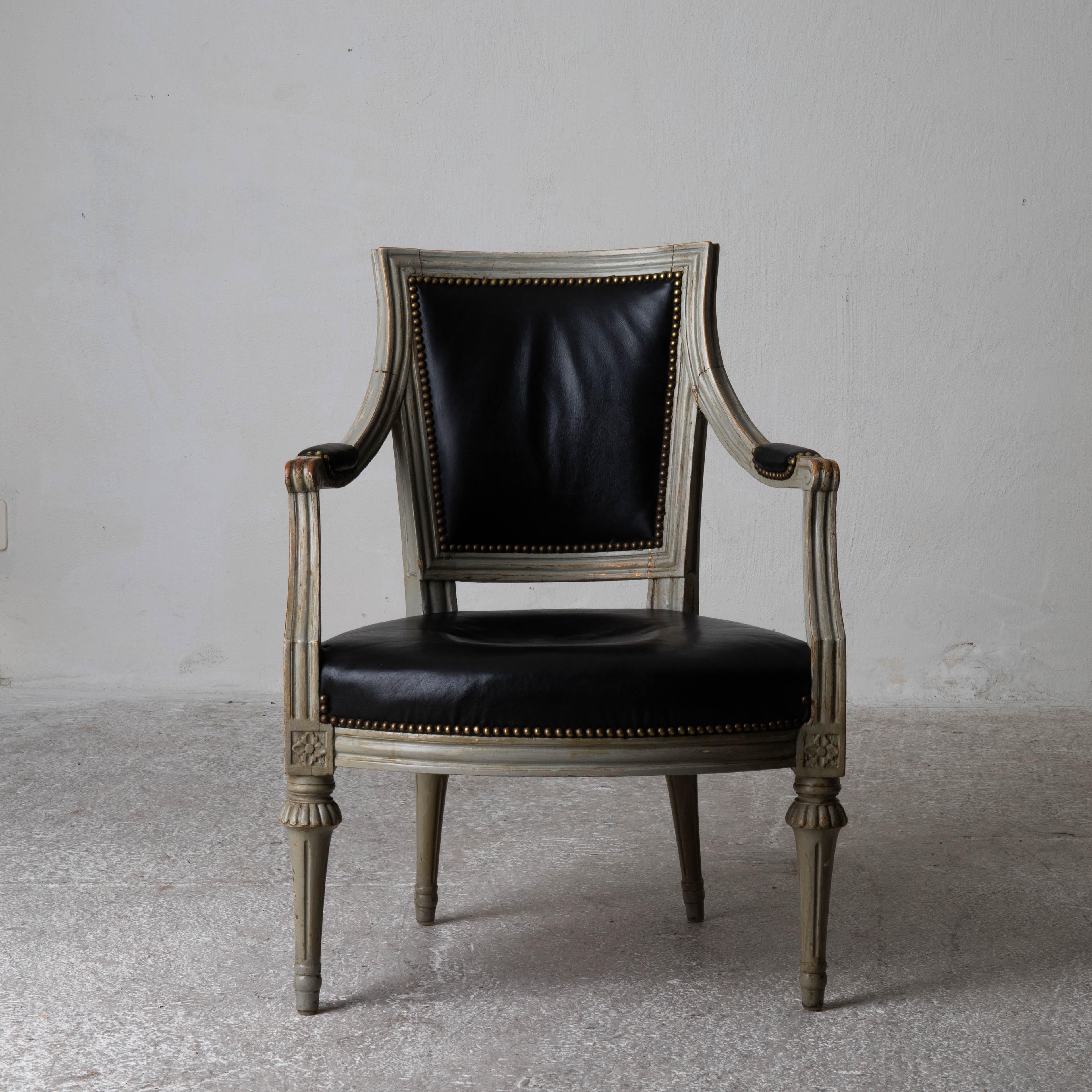 Armchair Swedish Gustavian 1790-1810 Greenish Frame with Black Upholstery Sweden. A single armchair made during the Gustavian period 1790-1810 in Sweden. Frame in original paint. Upholstered in a black leather trimmed with brass nailheads.