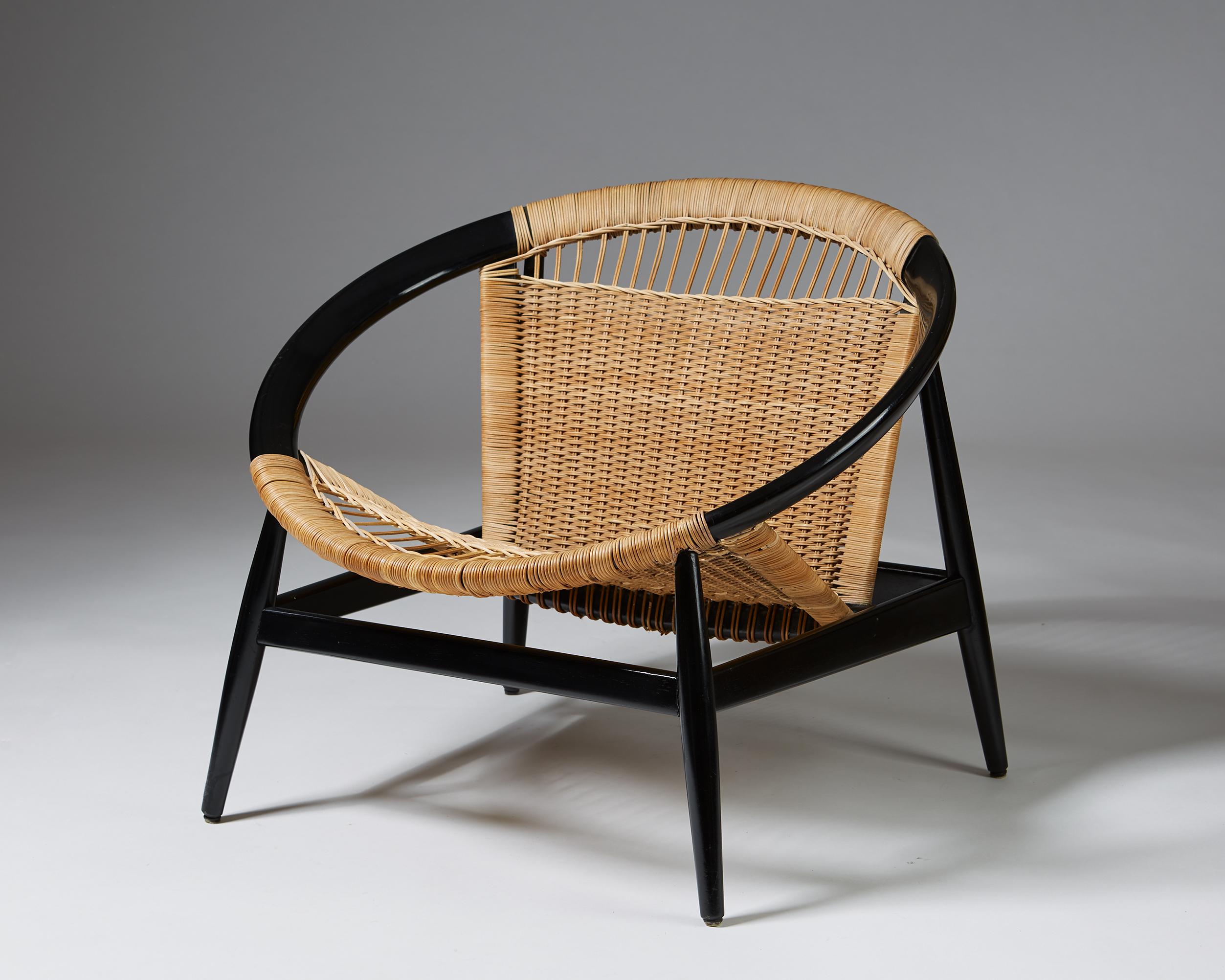Armchair the ring chair number 23 by Illum Wikkelsö for Niels Eilersen, Denmark. Lacquered beech and cane.