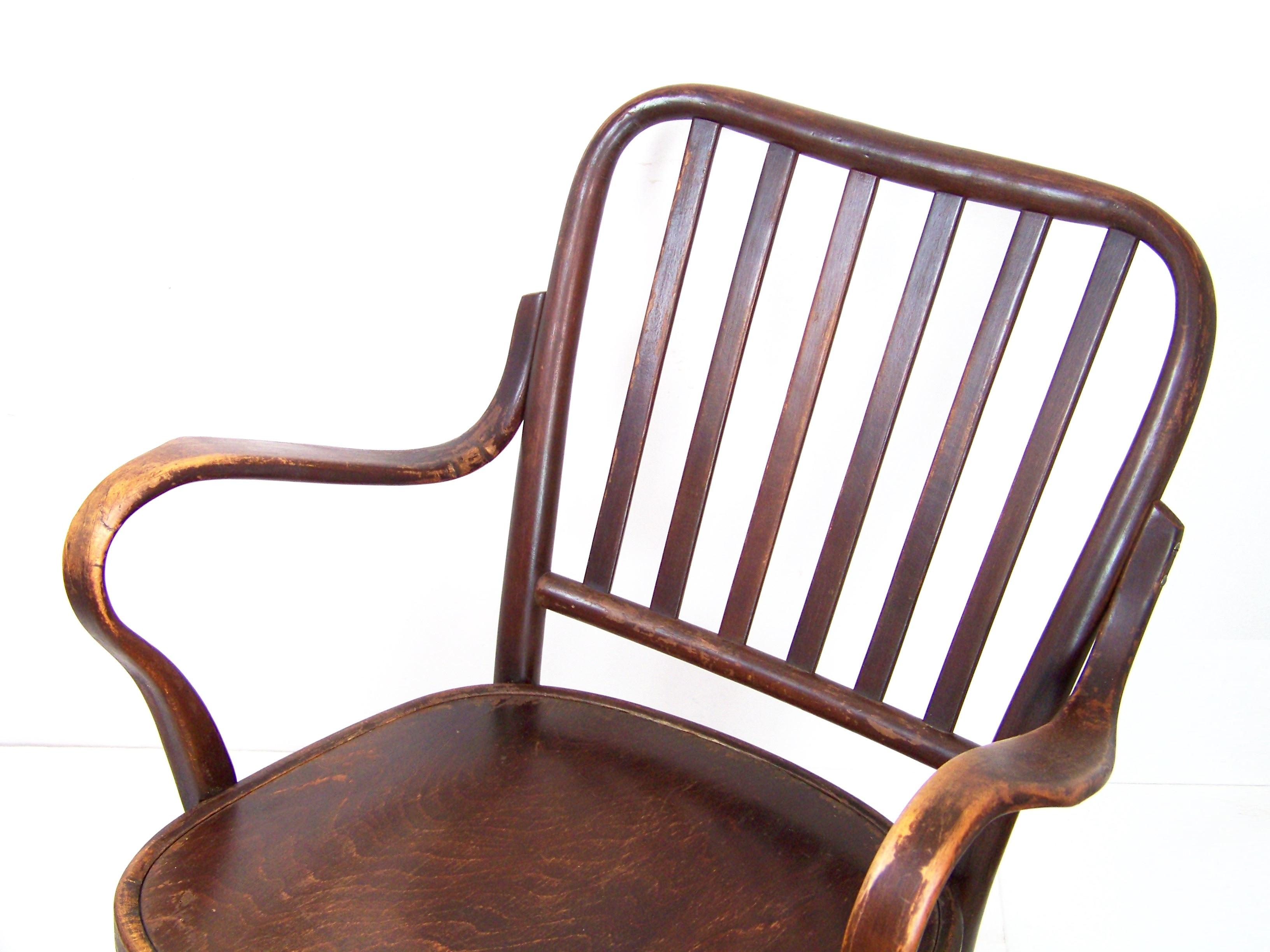 Designed by Frank Josef in year 1933. Original state with a pleasant patine of age. Cleaned and gentle re-polished with shellack finish. On the backrest were repaired cracks. Small traces of the already inactive worm infestation treated with