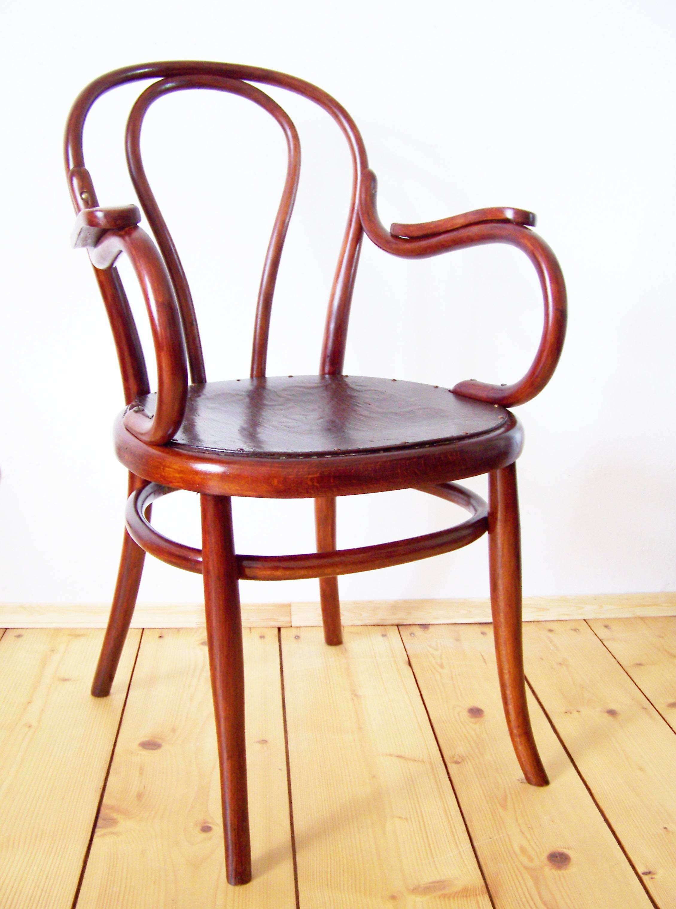 Armchair was included in the production program of the company Gebrüder Thonet in 1876. Marked with stamp Thonet, which is used between years 1861 and 1881. Original restored polish, stringed seat replaced with a plywood board with decor.