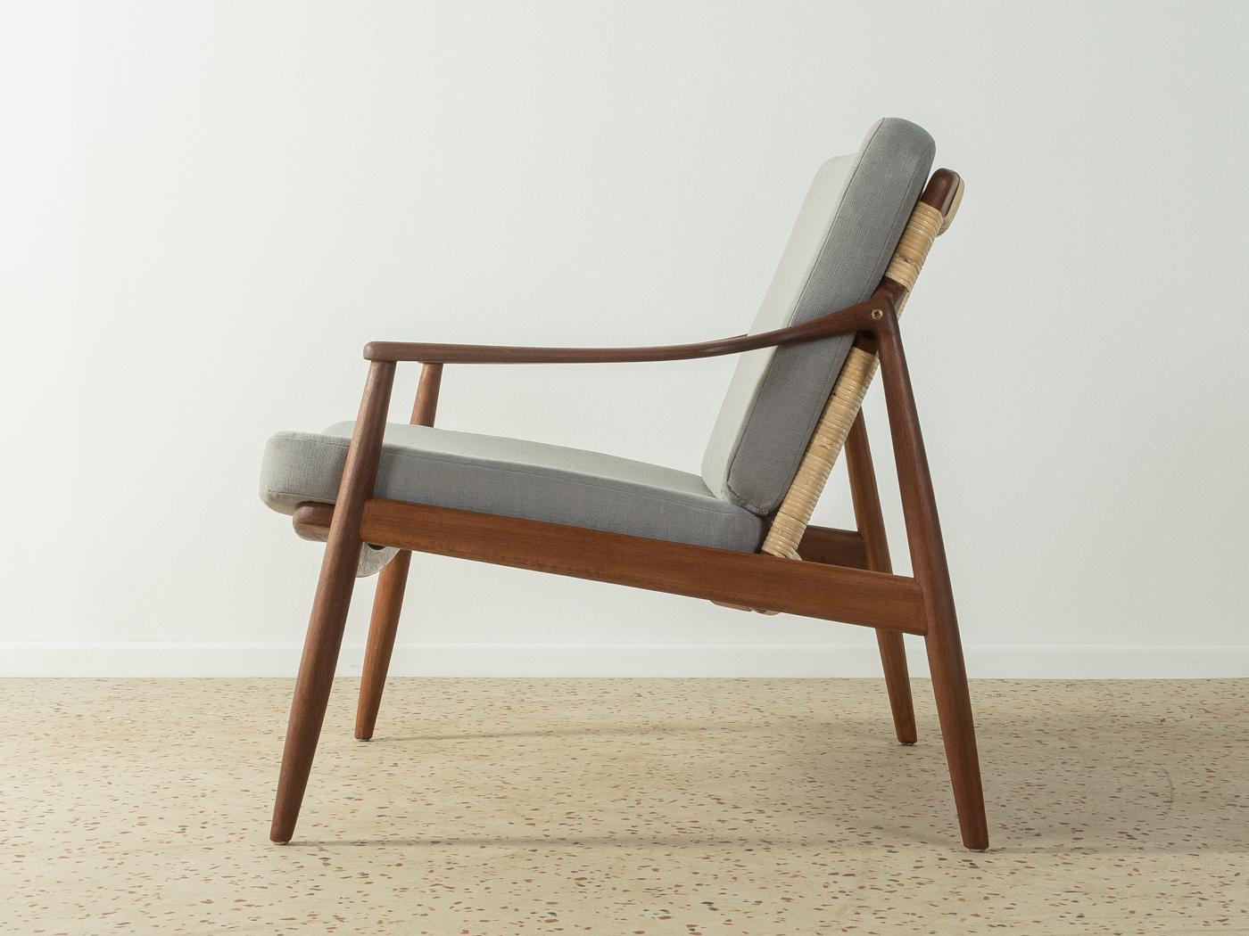 xclusive armchair, Type 400, from the 1950s by Hartmut Lohmeyer for Wilkhahn. High-quality teak frame with new, contemporary wicker work. The armchair has been reupholstered and covered with a high-quality grey upholstery fabric.

Quality