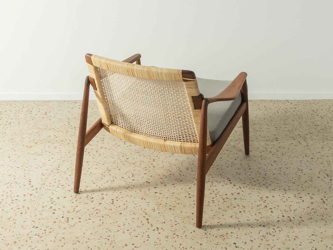 xclusive armchair, Type 400, from the 1950s by Hartmut Lohmeyer for Wilkhahn. High-quality teak frame with new, contemporary wicker work. The armchair has been reupholstered and covered with a high-quality grey upholstery fabric.

Quality