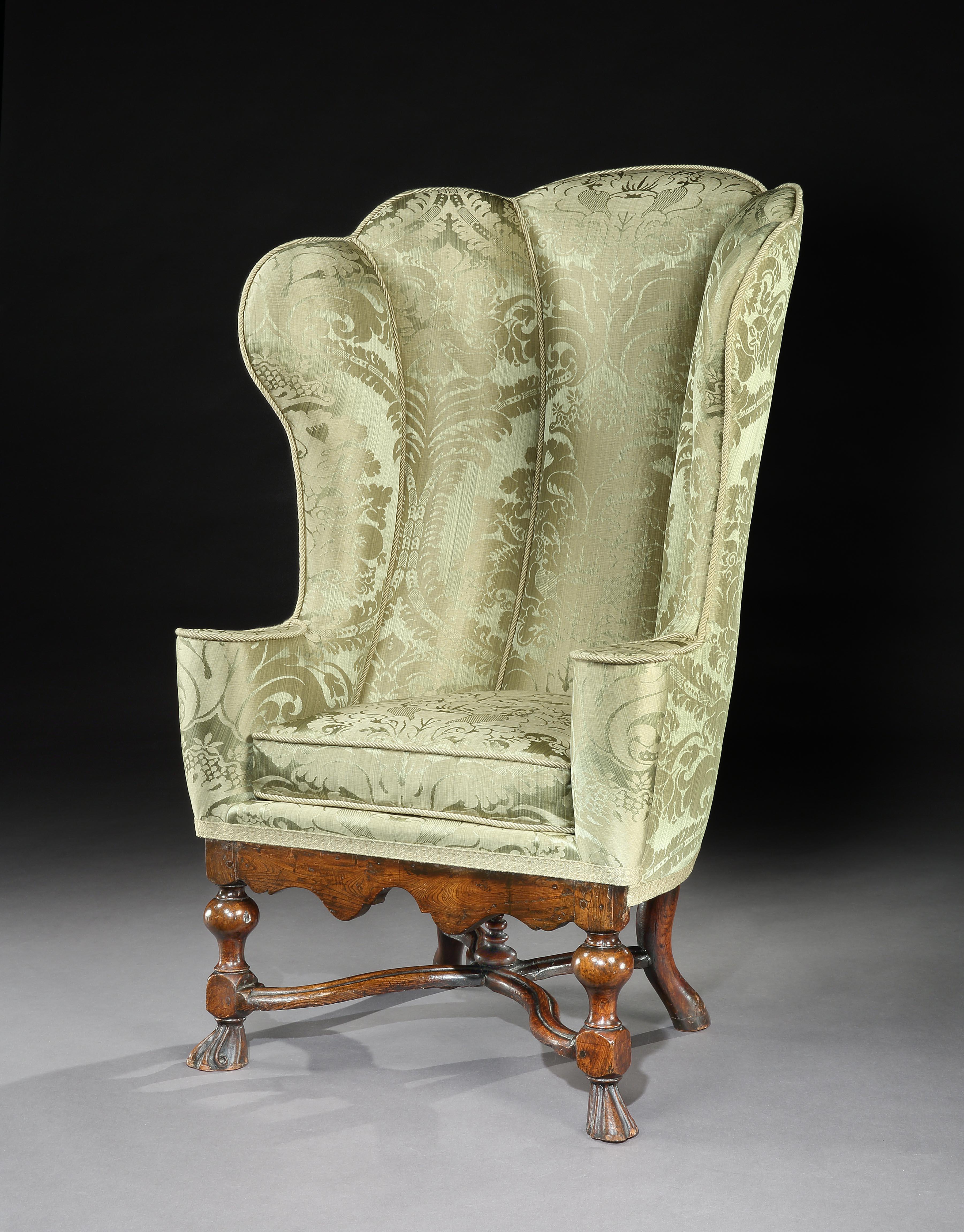 An exceptionally, rare 18th century, upholstered, elm, wing armchair with a scalloped back from Notley Priory & The Collection of Vivien Leigh & Laurence Oliver by Descent

- Acquired with a rare, scalloped back wing armchair from the Estate of