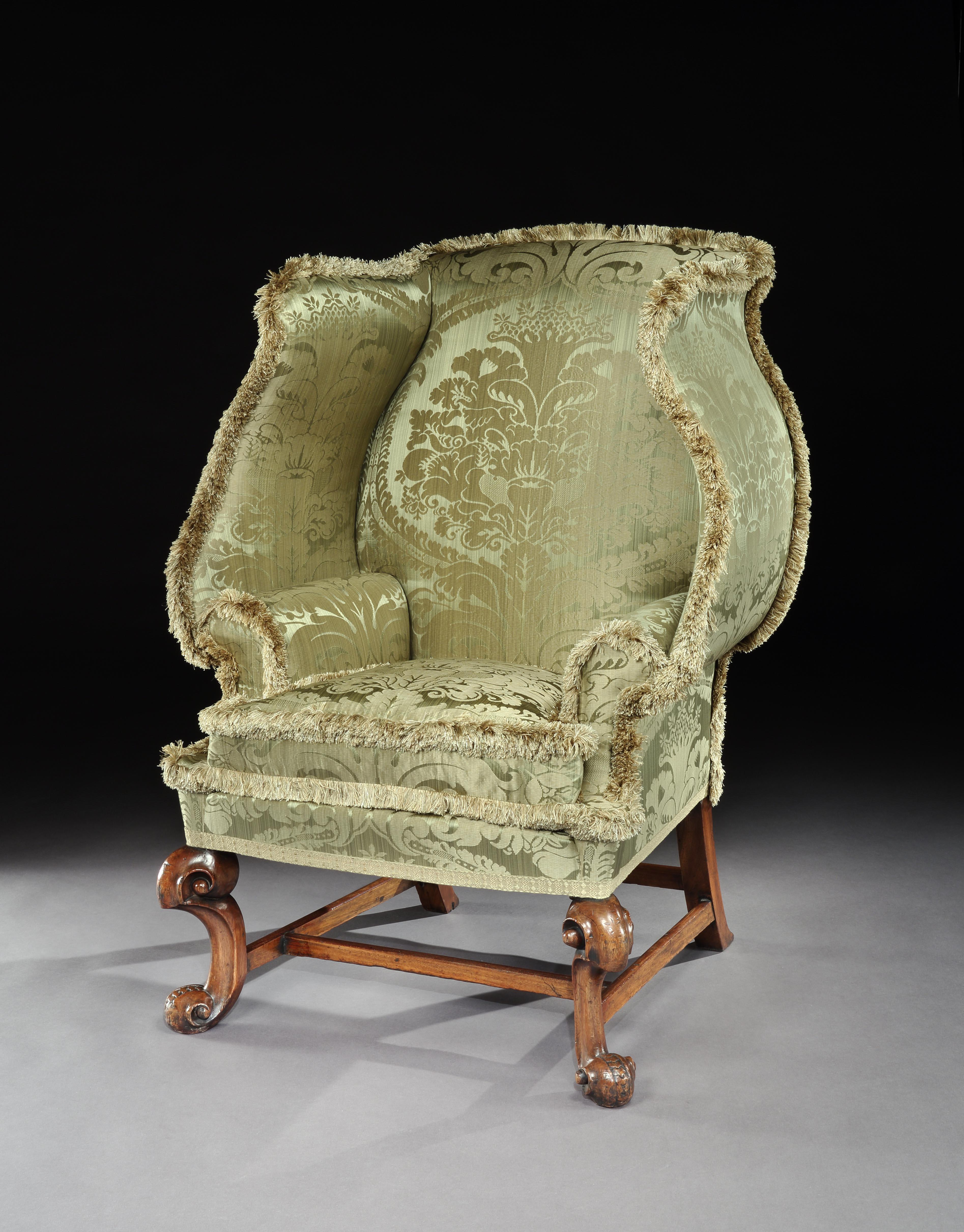 An exceptionally, rare 18th century, upholstered wing armchair with a scalloped back from Notley Priory & the collection of Vivien Leigh & Laurence Oliver by descent

- Acquired with a rare, shell back wing armchair from the Estate of Vivien