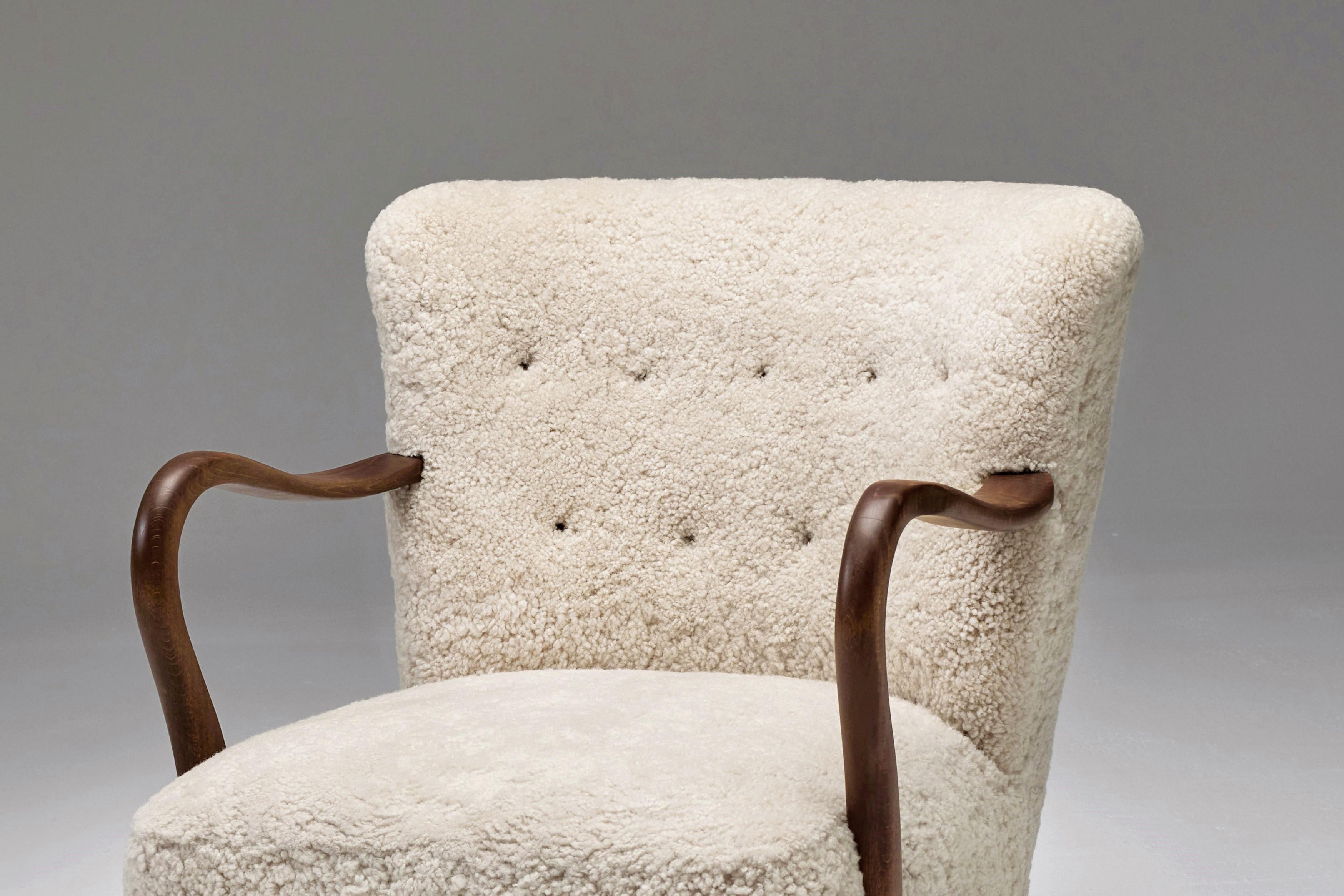 Sheepskin  Armchair with Curved Wooden Armrests by Danish Cabinetmaker, 1950s For Sale