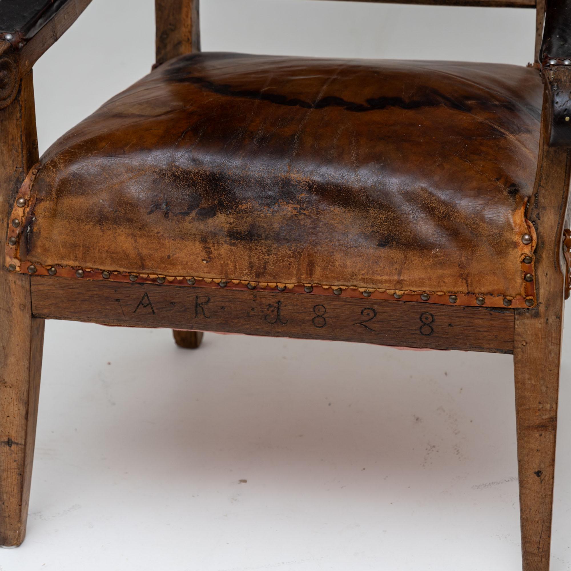 Armchair with leather upholstery, dated 1828 In Fair Condition For Sale In Greding, DE