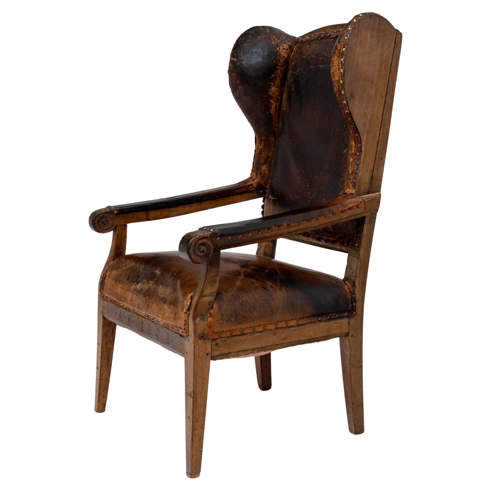 Armchair with leather upholstery, dated 1828 For Sale
