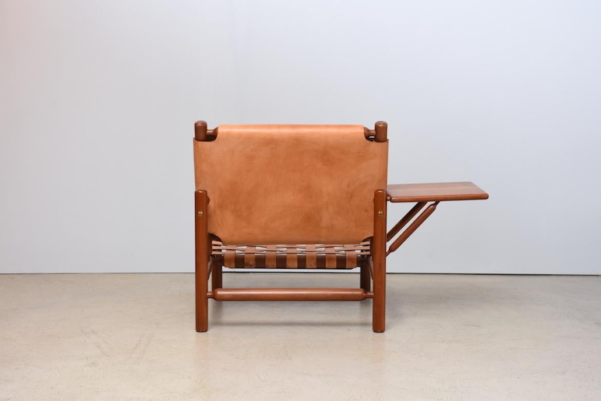 Armchair with Ottoman by Ilmari Tapiovaara for Paolo Arnaboldi, Italy 1950s. Exquisite armchair with matching ottoman by the great Ilamri Tapiovaara. Designed in 1957. Leather upholstery of the armchair partially renewed. Leather of ottoman with