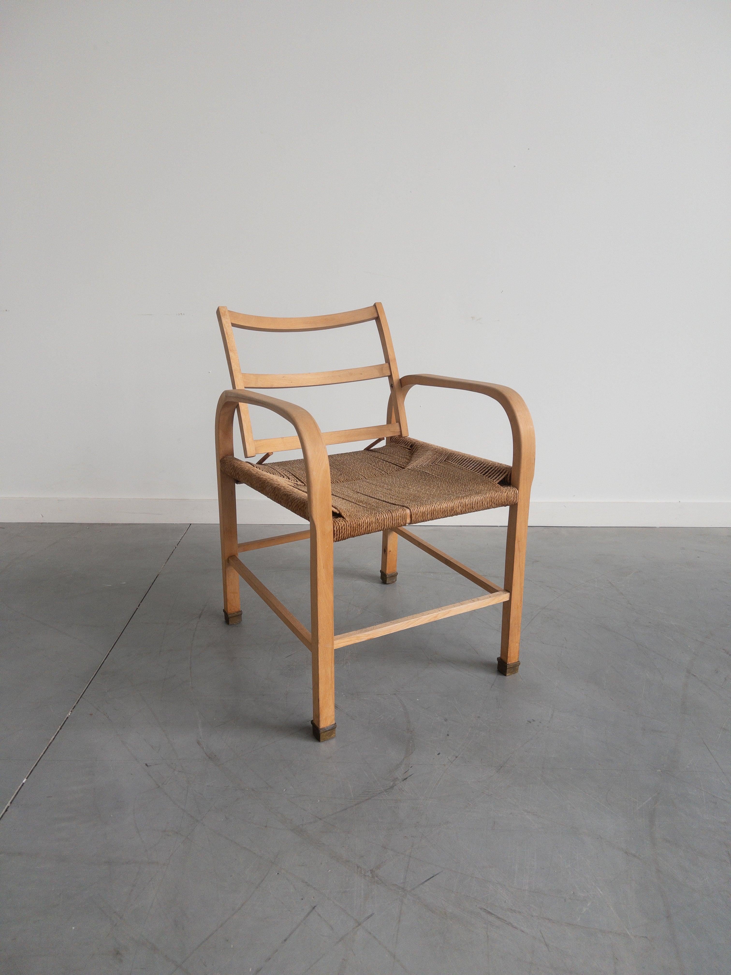 Armchair by Magnus Stephensen for Cabinet maker Clausen, in beech, woven seaweed and leather, Denmark, circa. 1933.

This armchair is designed by Danish architect Magnus Læssøe Stephensen. The designer focused on the creation of a chair that