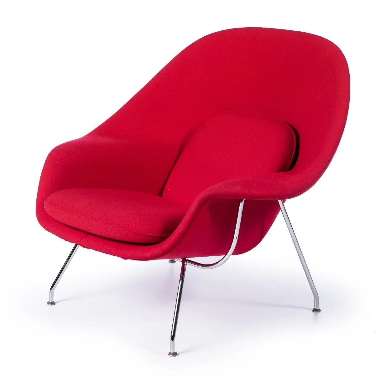 Armchair Womb chair
Created in 1948 by designer Eero Saarinen for Knoll. 
Seat and back in burgundy tones. 
Knoll marked stainless steel base. 
Dim.: 92 x 79 x 104 cm.

Eero Saarinen
b. Finland
1910-1961
Born to world famous parents,