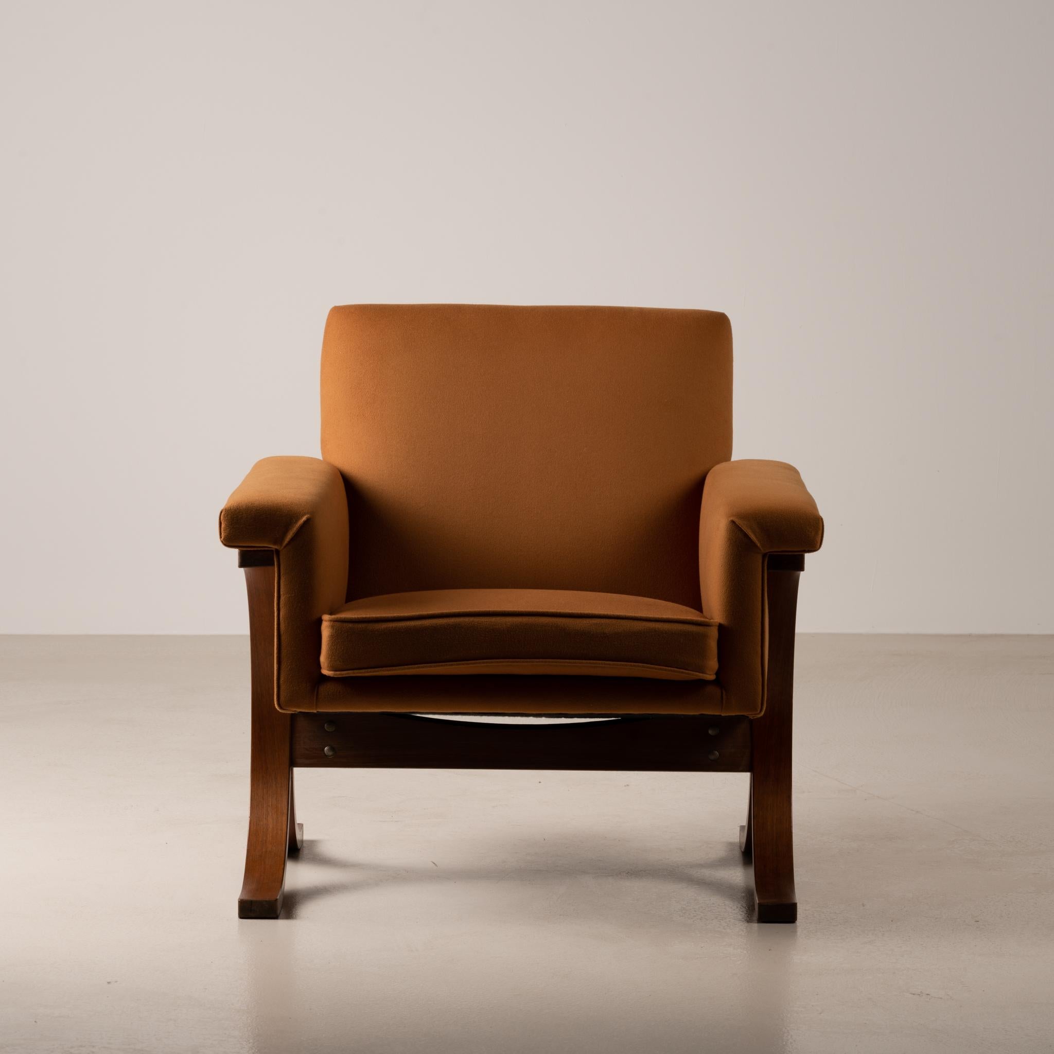 This very unique vintage armchair has been manufactured by Tendo Mokko in the 1960's. It is a very rare item coming from a facilities in Japan, after the relocation of the warehouse, using the molded-plywood technique. Design lovers will appreciate