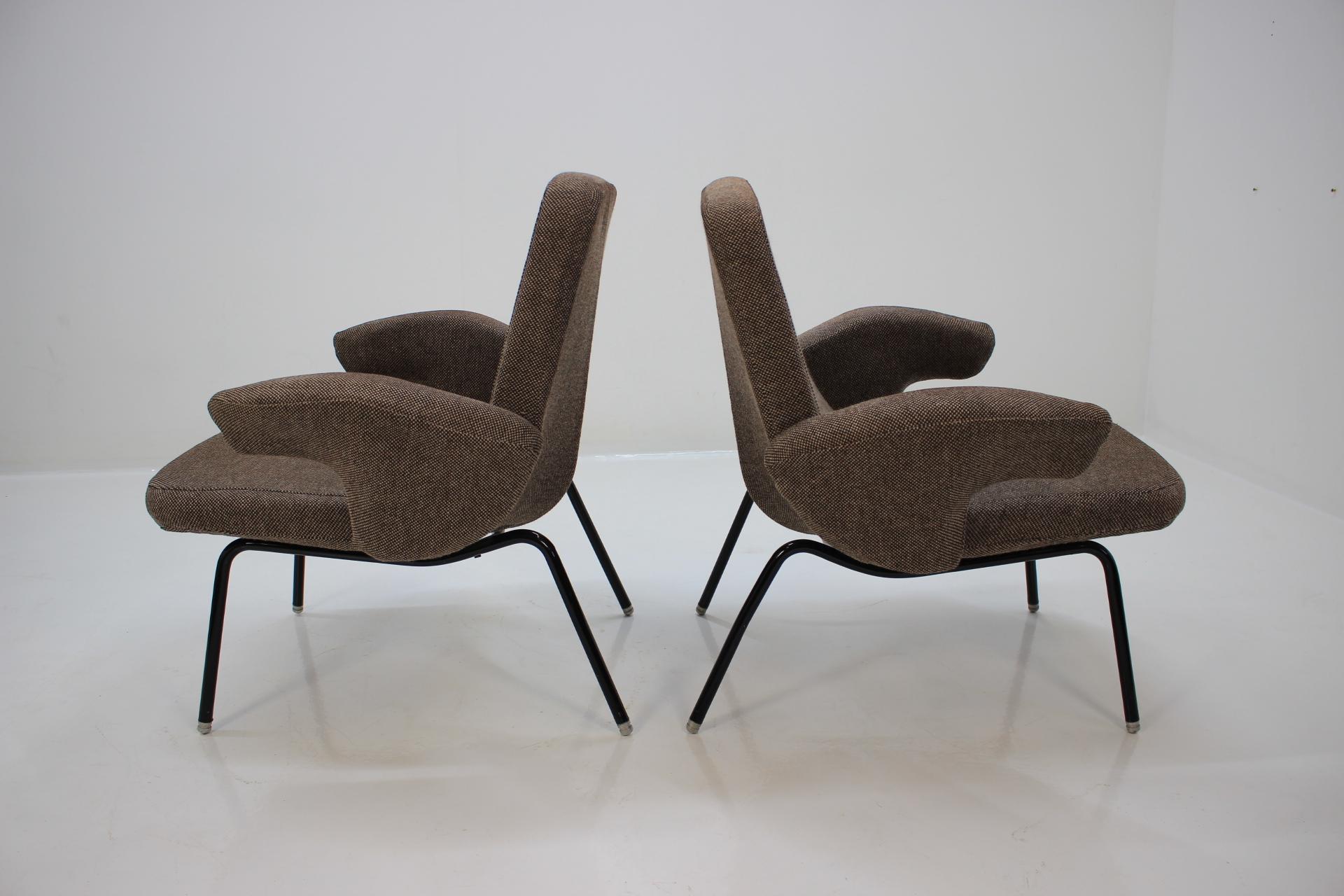 Set of two armchairs and four chairs designed by Alan Fuchs in 1961 for experimental housing estate Invalidovna in Prague. This avantgarde set is in very good original condition including four cushions for armchairs. Dimensions of the chairs: Height