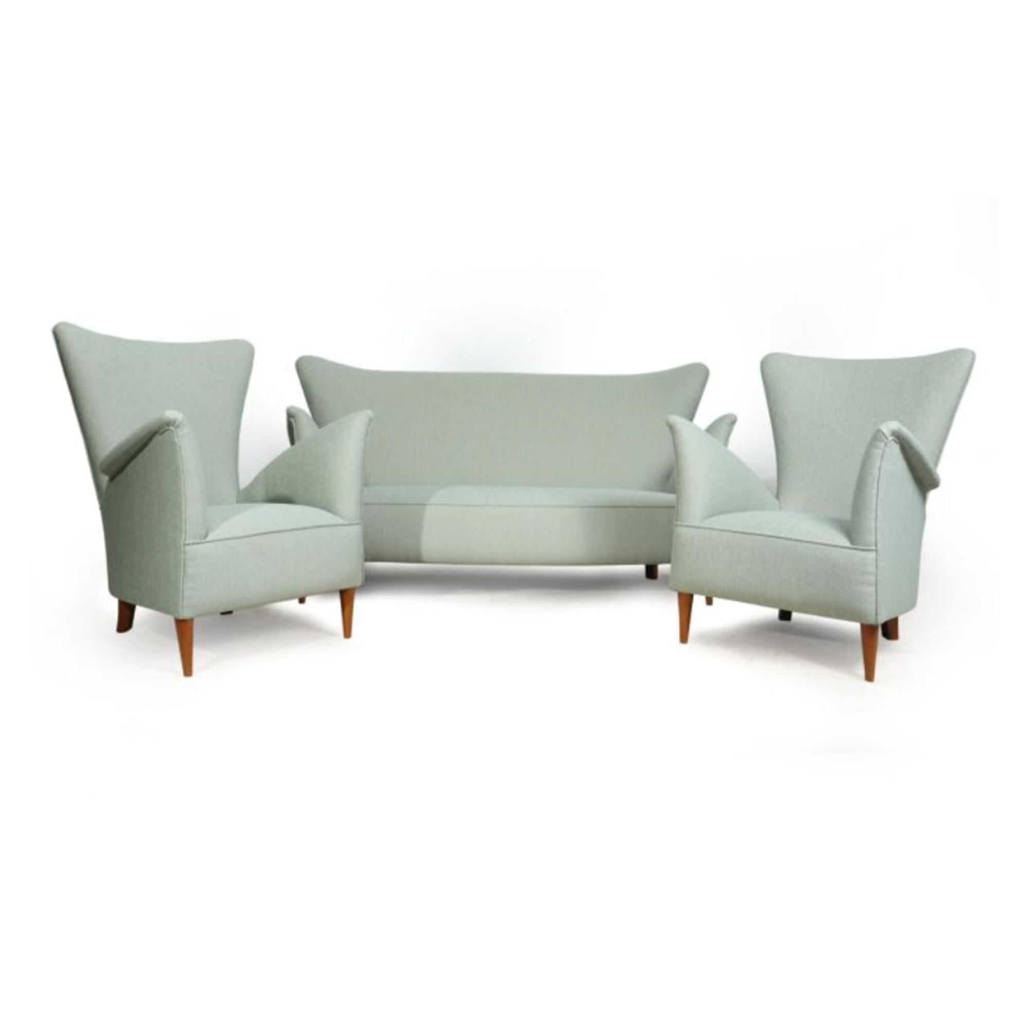 Armchairs and sofa by Gio Ponti for Hotel Bristol Merano c1954

A Pair of armchairs and a sofa designed by Gio Ponti for the Hotel Bristol in 1954, this set has been fully upholstered, covered in thick mint and silver colour geometric fabric and