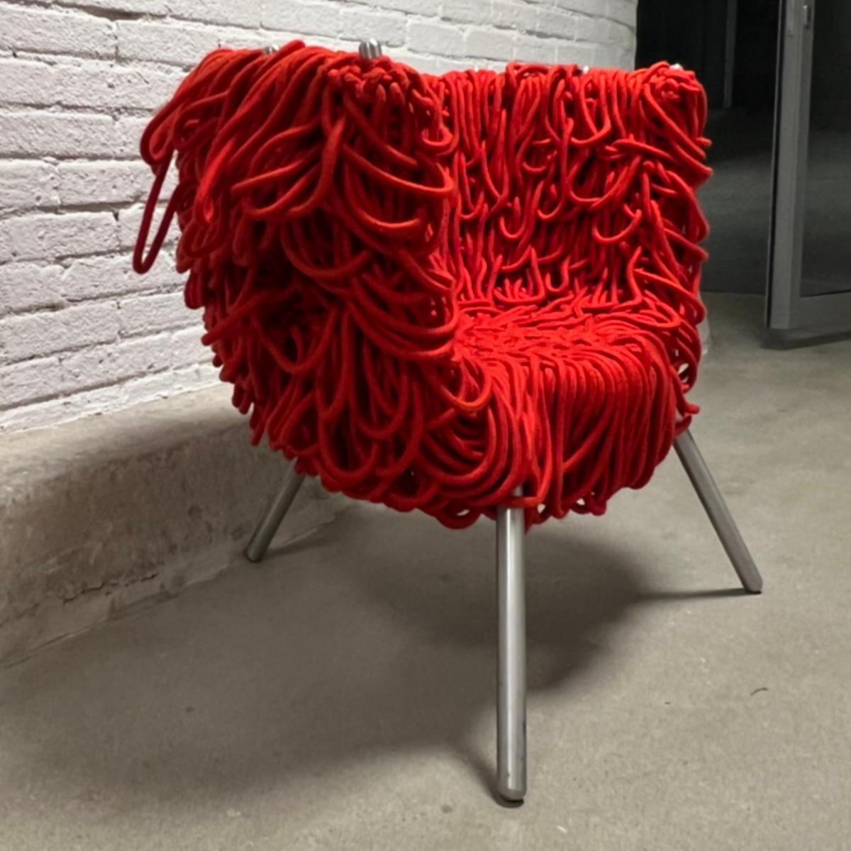 Made of Iron, aluminum and cord.
The renowned furniture designers, the Campana brothers, are known for their use of unconventional materials in their design practice. These materials often remain the vibrant street culture and traditions of 