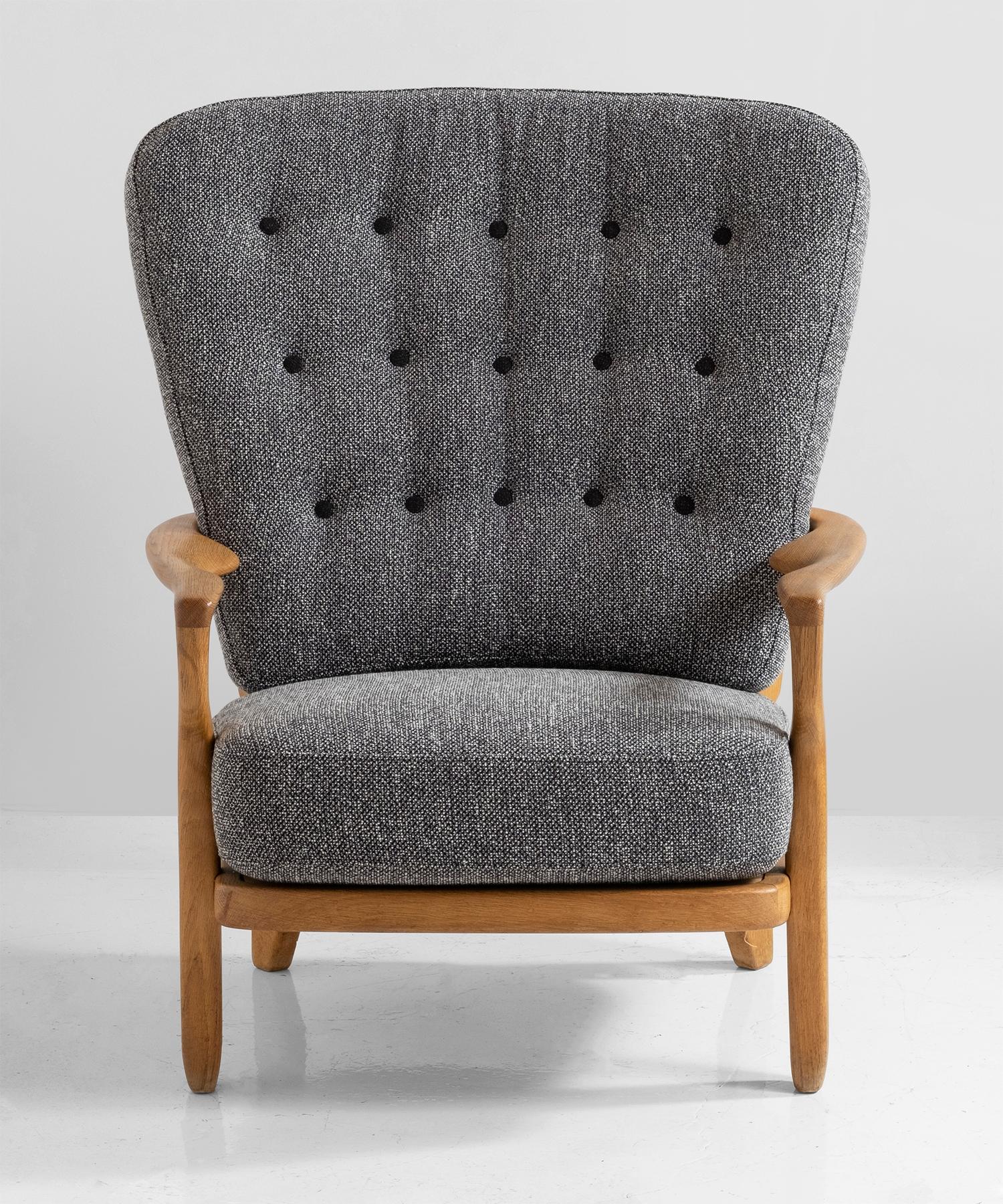 Armchairs by Guillerme et Chambron
Carved oak frame with upholstered seat and back.
