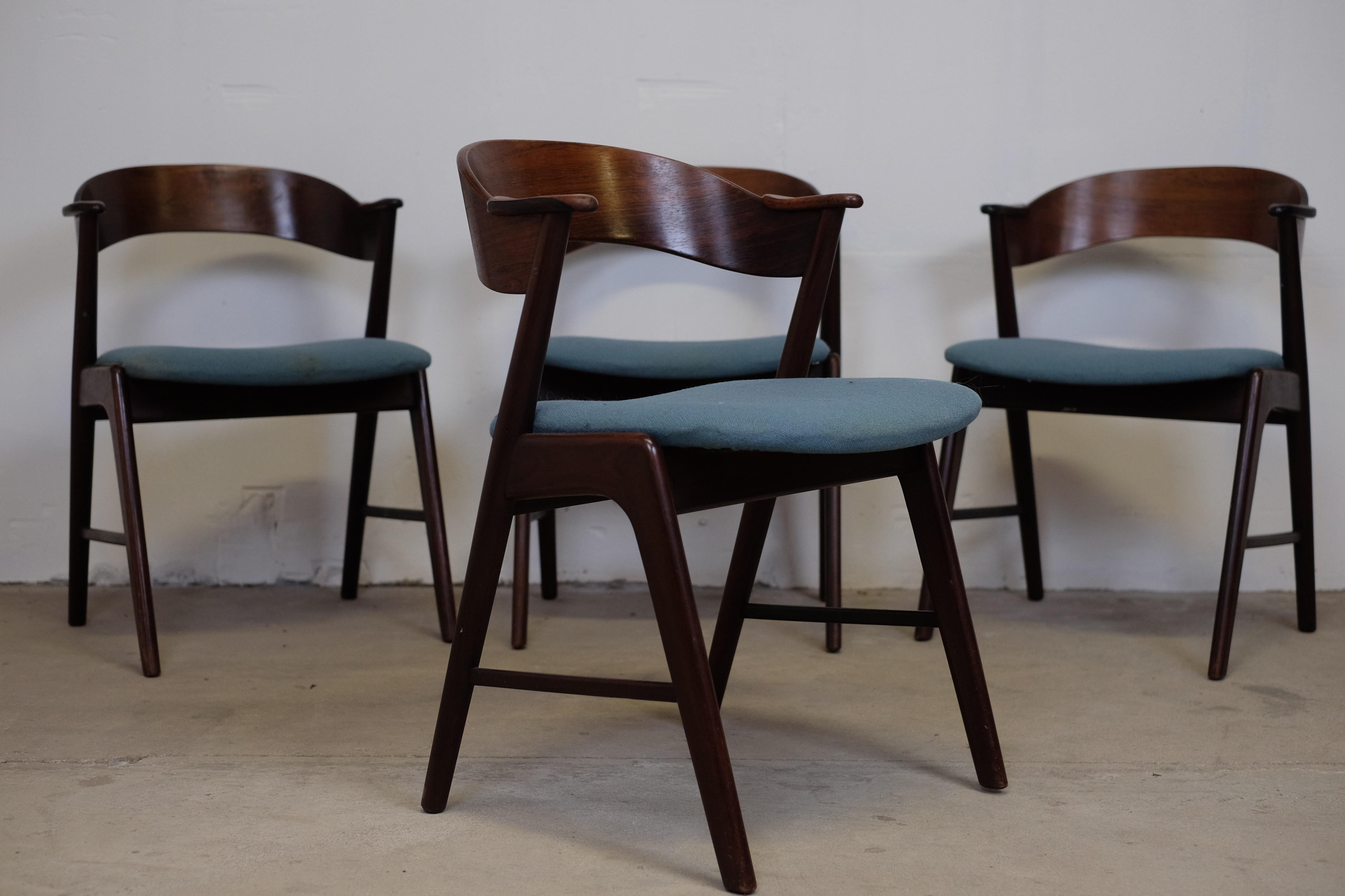 Very beautiful set of four dining chairs by Kai Kristiansen for Korup Stolefabrik. The chairs feature a comfortable curved back in rosewood with beautiful armrests also in rosewood. Stamped 