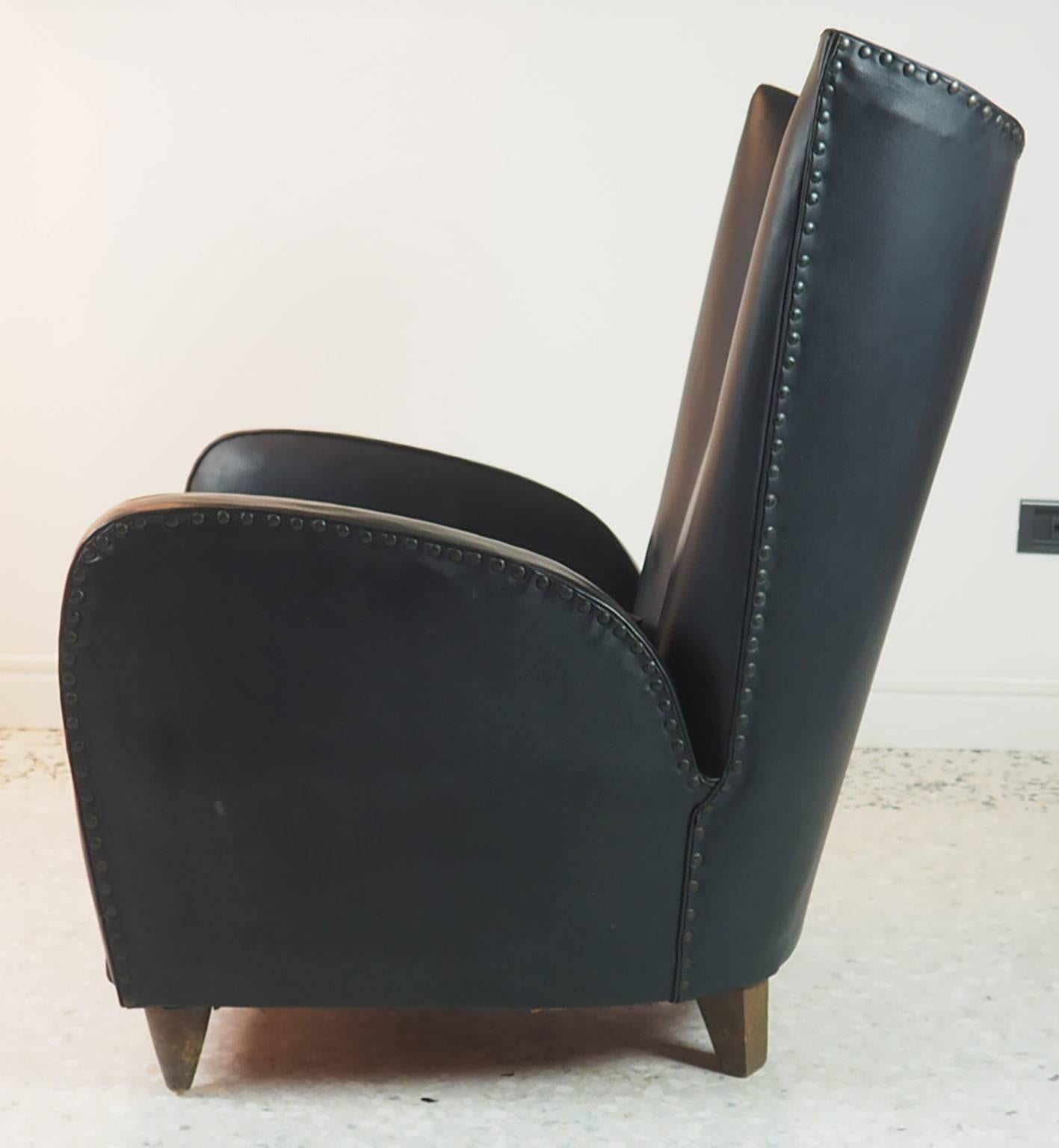 Pair of fine Paolo Buffa armchairs produced in Italy in 1950 with its original faux dark green leather cover.
Very good original condition, the cover is perfect without damage. The back is Oki, the seat has lost its natural elasticity but can be