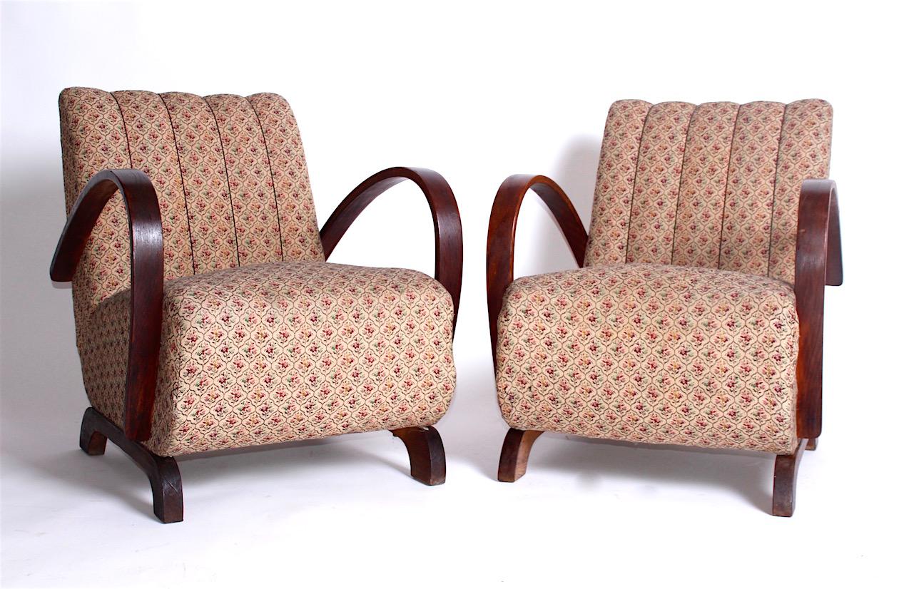 Pair of armchairs are in original condition. The wood is solid, nice. The upholstery is not torn, but it is original, so rather for renovation.