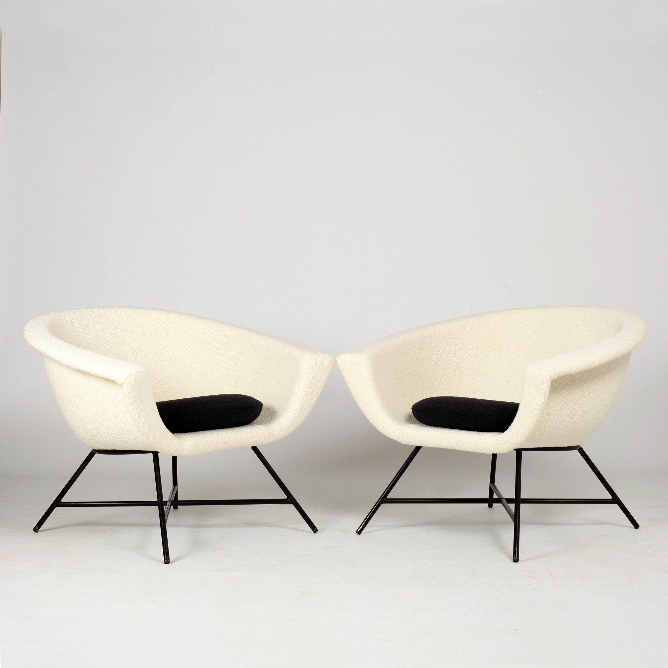 Beautiful pair of armchairs model 58 first edition by Genevieve Dangles and Christian Defrance. The chairs have a black lacquered metal base and fiberglass shell
newly upholstered in Pierre Frey and Dedar fabric.
References : 