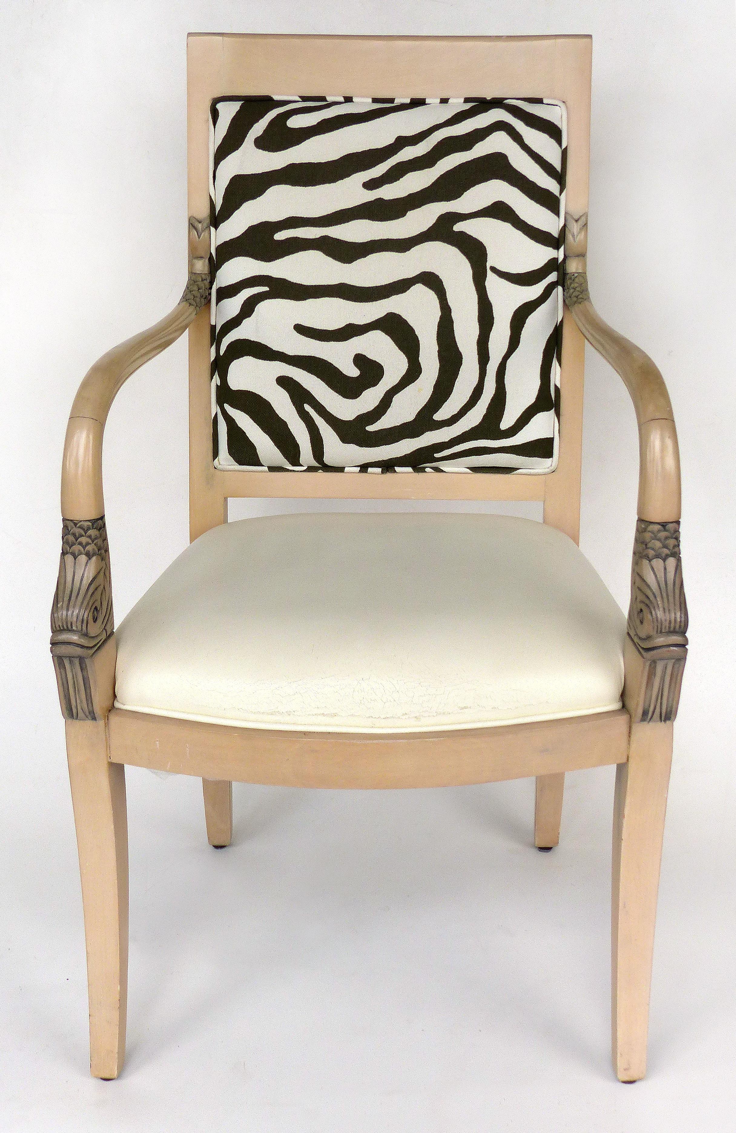 Armchairs of Blond Wood with Zebra Print Upholstery and Dolphin Carved Arms

Offered for sale is a pair of blond wood armchairs with dolphin carved arms and zebra print upholstery, the seats are in need of re-upholstery as pictured, arm, 29.75