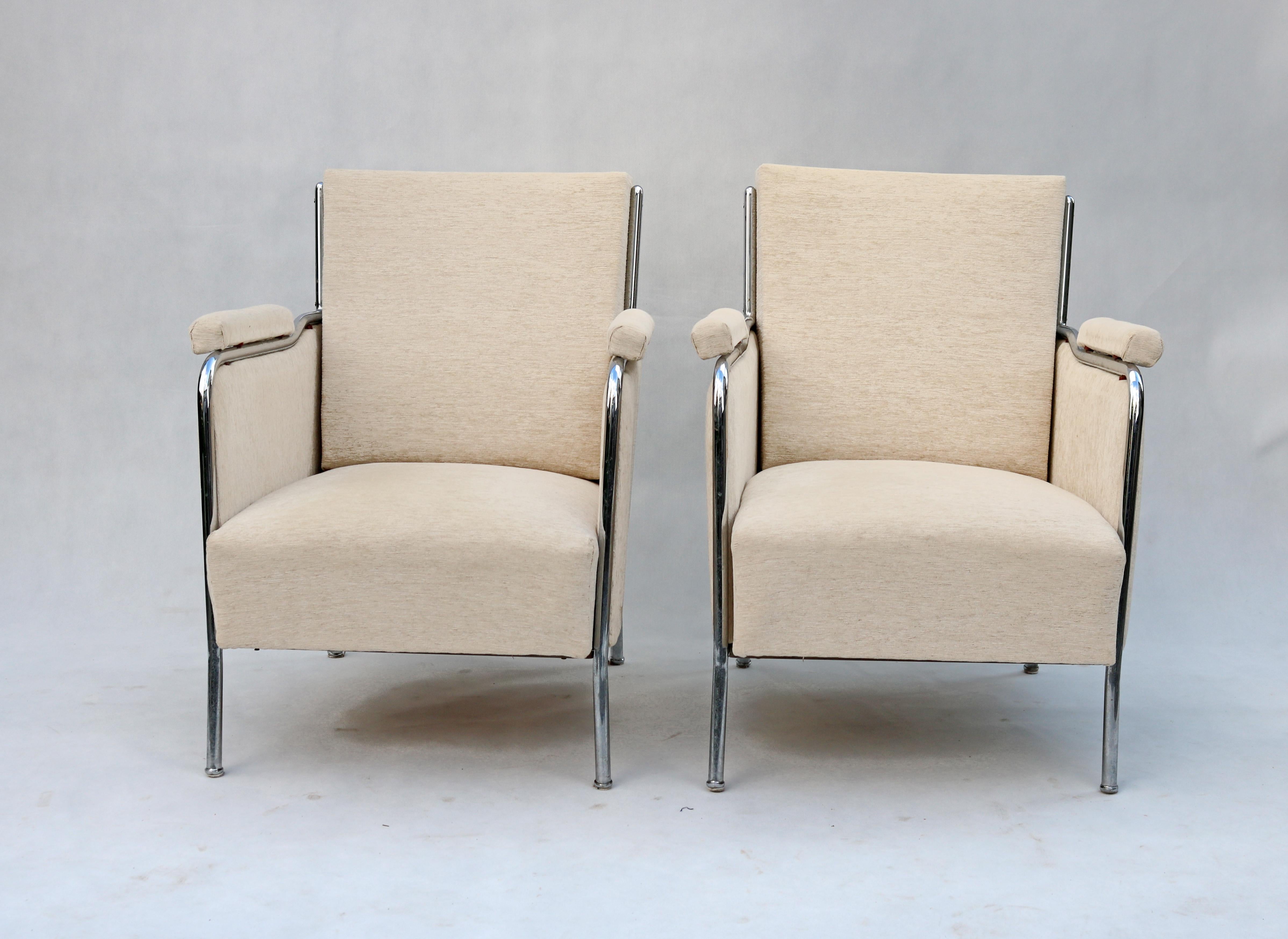 This is a unique set of two armchairs and a table, which were manufactured for the 1958 Brussels World's Fair. They were designed by Hungarian designer Joszef Peresztegi. They are a beautiful example of functionalist design with their chrome accents