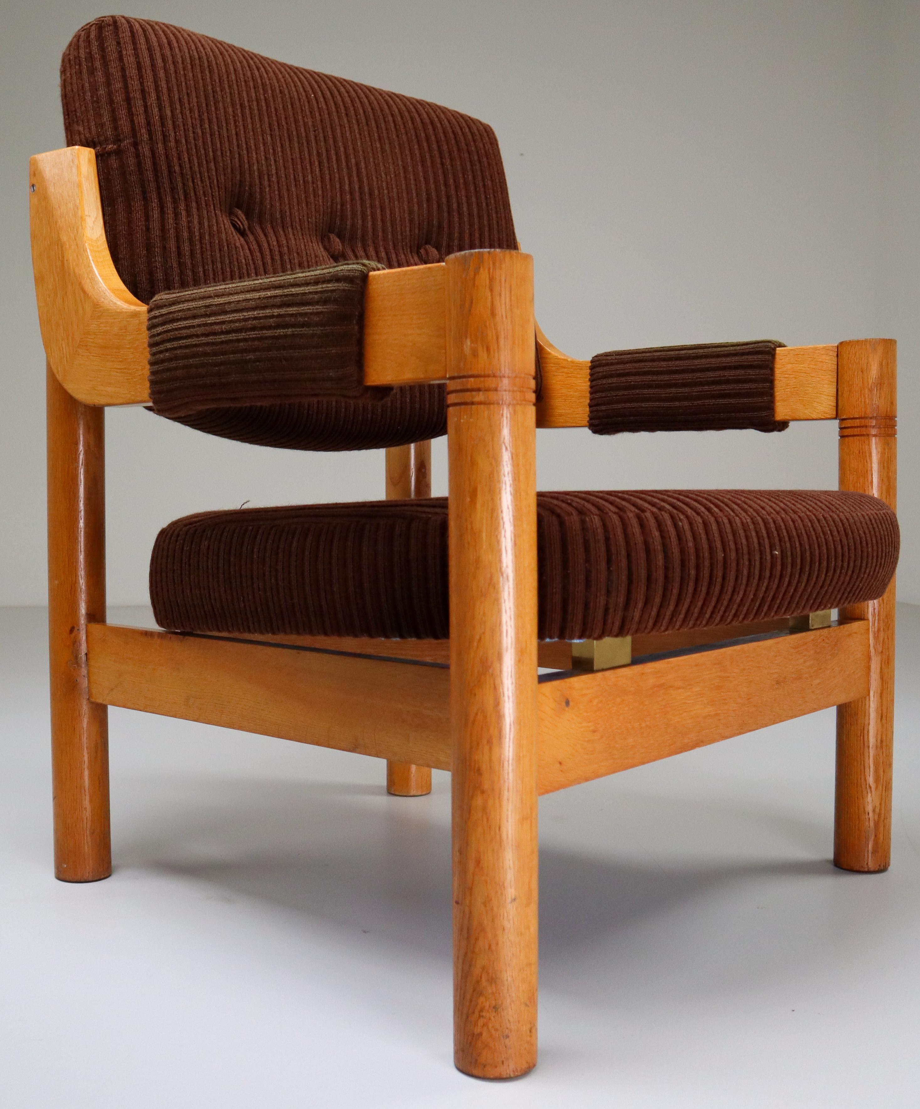 Armchairs in patinated solid oak and original Fabric from the Netherlands, 1960s. The grain of the wood is nicely visible, especially on the wide solid armrests. These armchairs would make an eye-catching addition to any interior such as living