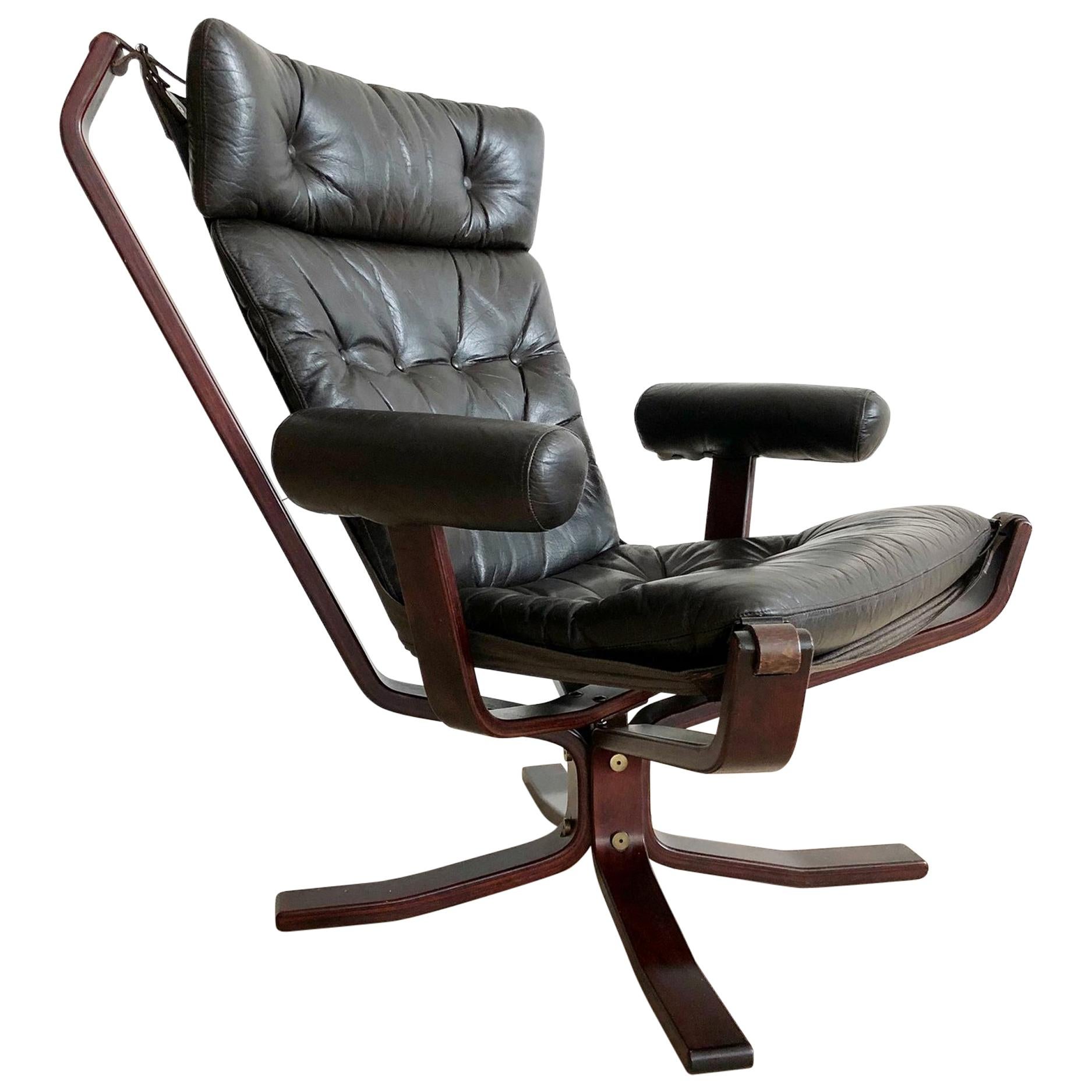 Armed 1960s Rosewood Norwegian Leather Falcon Style Chair After Sigurd Ressell For Sale