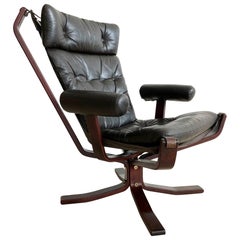 Vintage Armed 1960s Rosewood Norwegian Leather Falcon Style Chair After Sigurd Ressell