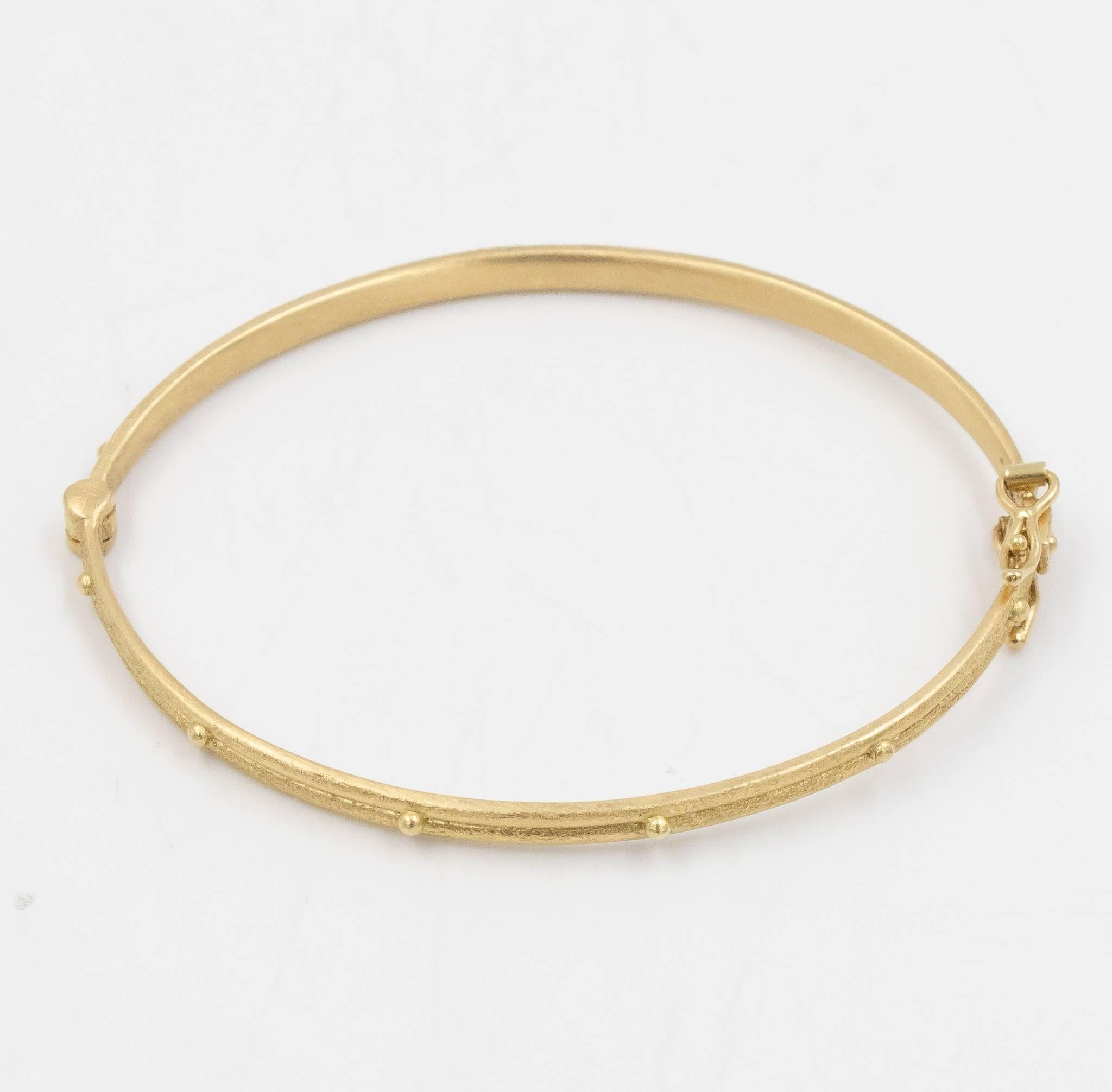This Armenta bangle with granulation decorated around the design is a fun and elegant piece for any occasion.  These bracelets wear very nicely on their own or stacked with other complimentary Armenta styles. This 02692 design features a hinge clasp