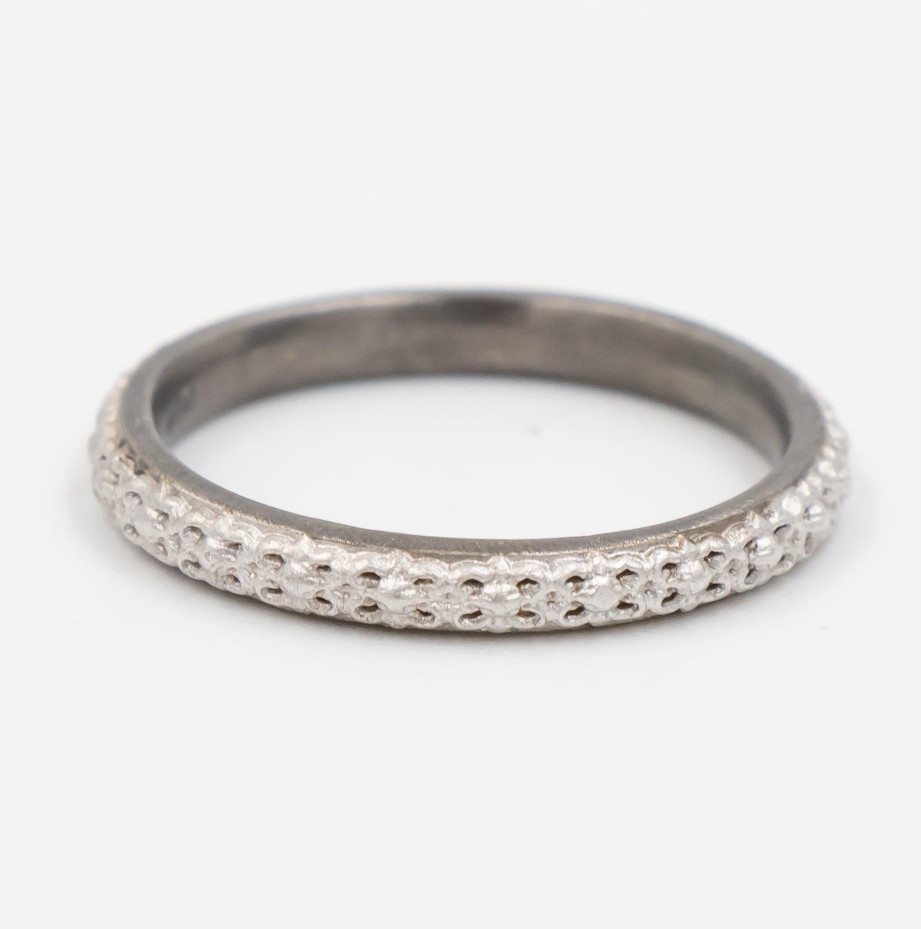 This Armenta ring is a part of the New World collection. It features oxidized sterling silver with a hand engraved design. 

Ring Size: 6.25
Width: 2.5mm

Armenta Style Number: 08734