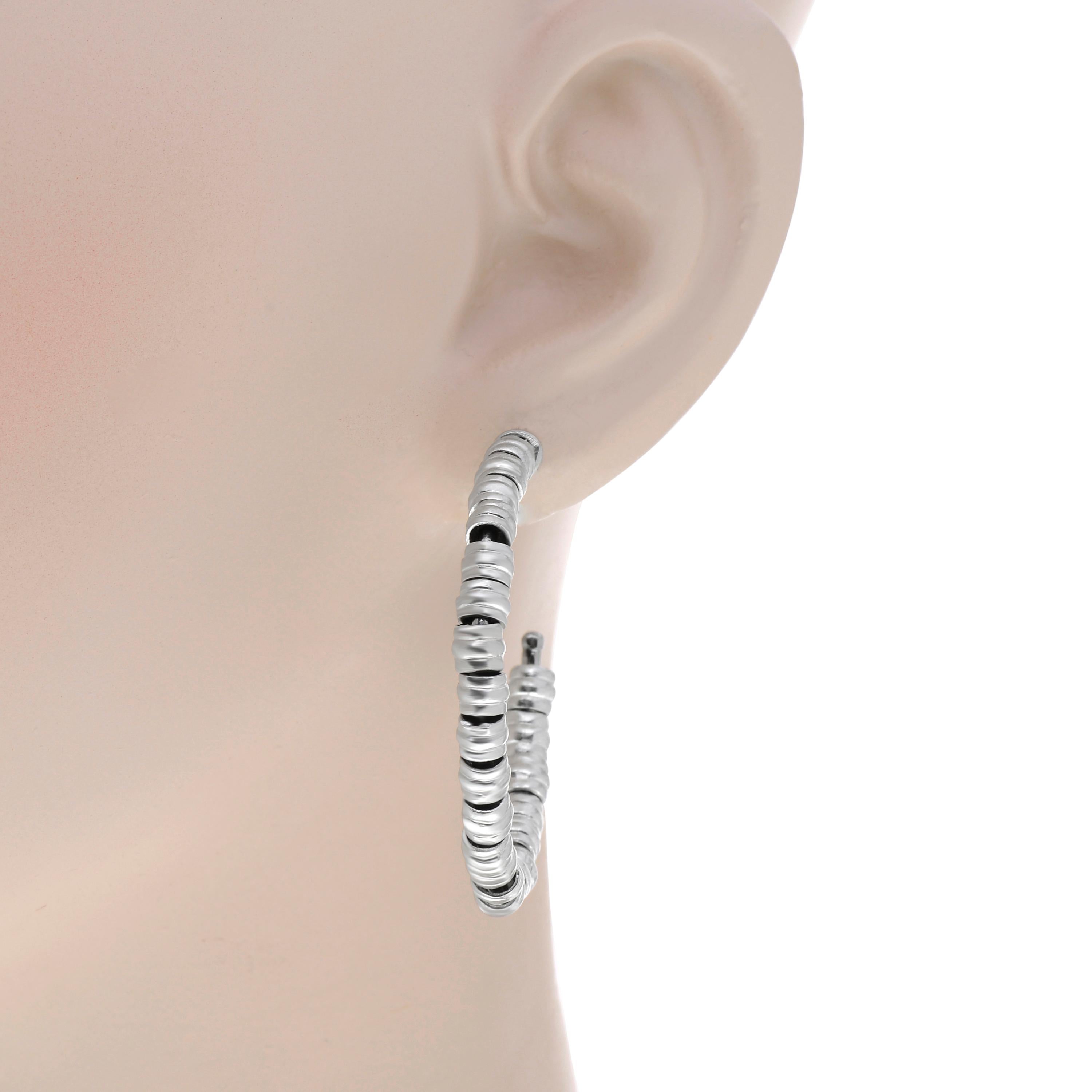 Armenta New World 14K white gold and sterling silver hoop earrings feature sterling silver and 18K white gold hoops set with 50 organic pebble beads. The total size is 1 3/4