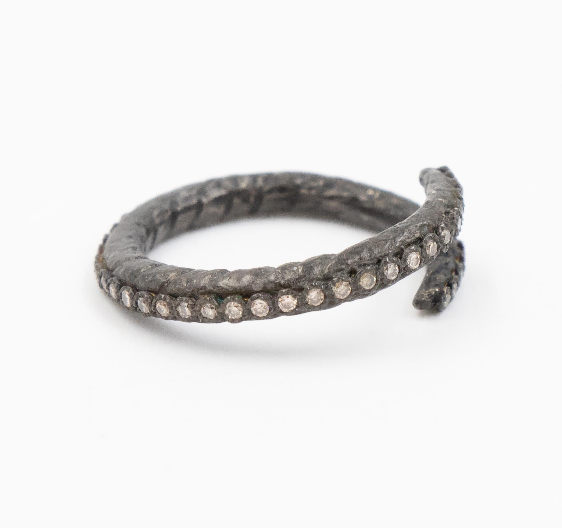 This silver Armenta ring from the Old World collection is a beautiful and fun fashion ring which can be worn for any occasion.  The silver is oxidized to give it a unique style and accented with champagne diamonds.

Internal Measurements: 

Ring