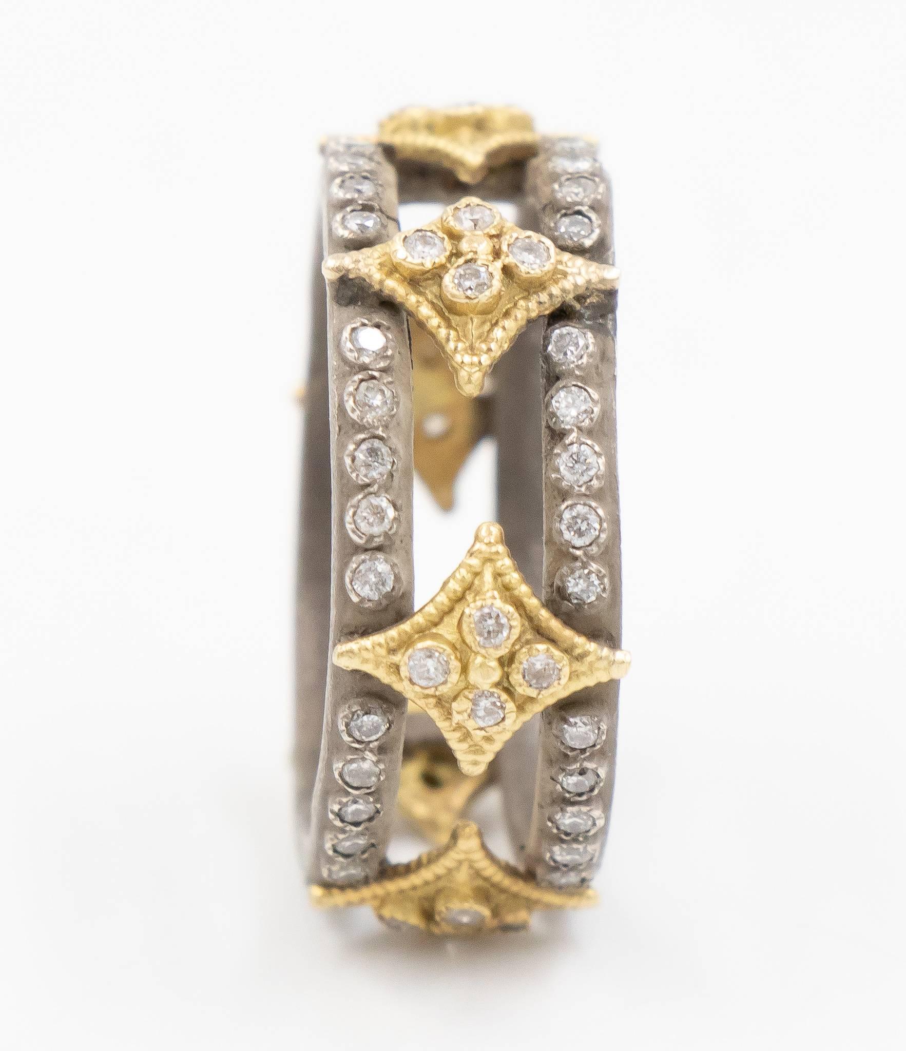 This Old World Collection ring by Armenta is in a fun eternity style ring. The two silver bands are inter-twined by 6 renaissance style 18k yellow gold diamond stations.  

Internal Measurements:

Ring Size: 6.5
Width: 7.50 mm

Size-able: