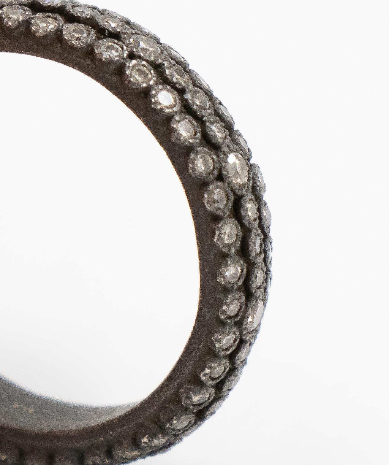 This Old World collection Armenta eternity ring featuring blackened silver and champagne diamonds has a perfect mix of luxury and casual style. This ring can be worn simply by itself or easily stacked with various other rings.  

Ring Size: