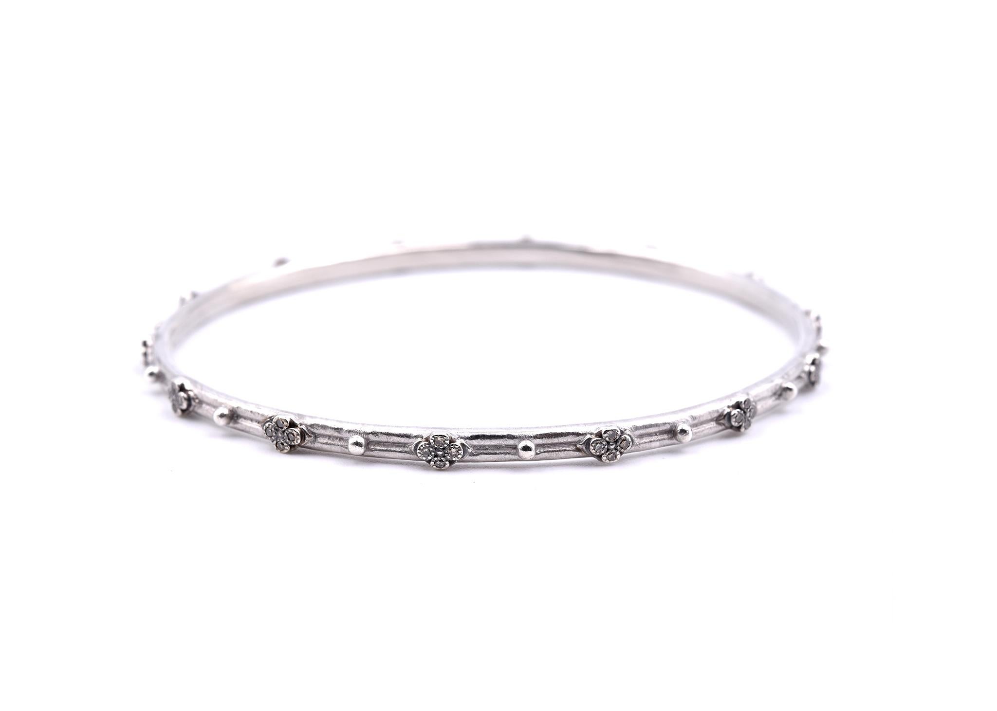 Designer: Armenta
Material: sterling silver
Diamonds: 56 round brilliant cuts = 0.30cttw
Color: chocolate
Dimensions: bangle will fit a 7 ½ inch wrist and it is 3.34mm wide
Weight: 11.61 grams
