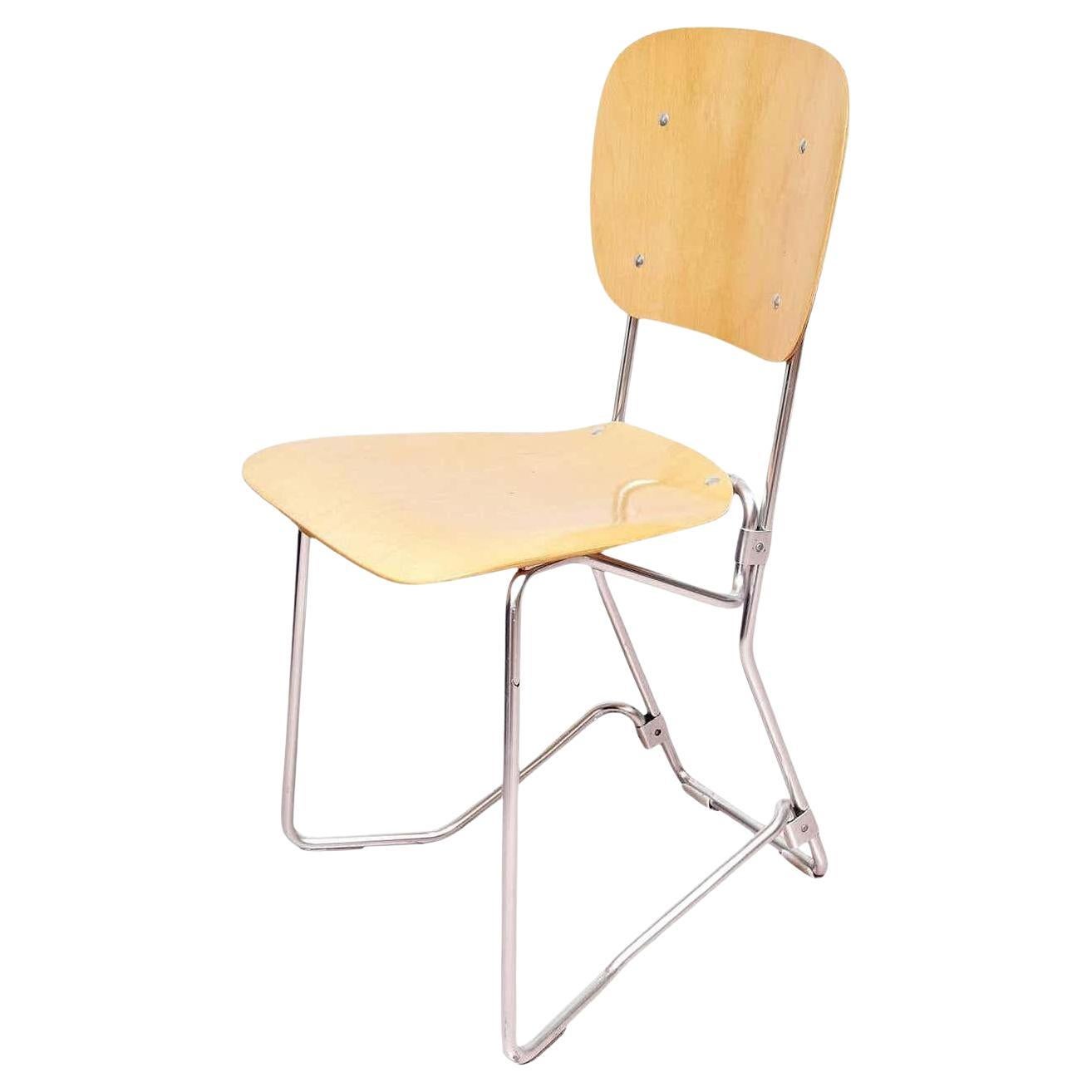 Stackable Aluflex chairs designed by Armin Wirth.
Manufactured by Aluflex, Switzerland, circa 1950.

Metal and plywood.

In good original condition, with minor wear consistent with age and use, preserving a beautiful patina.

2x Chairs available.