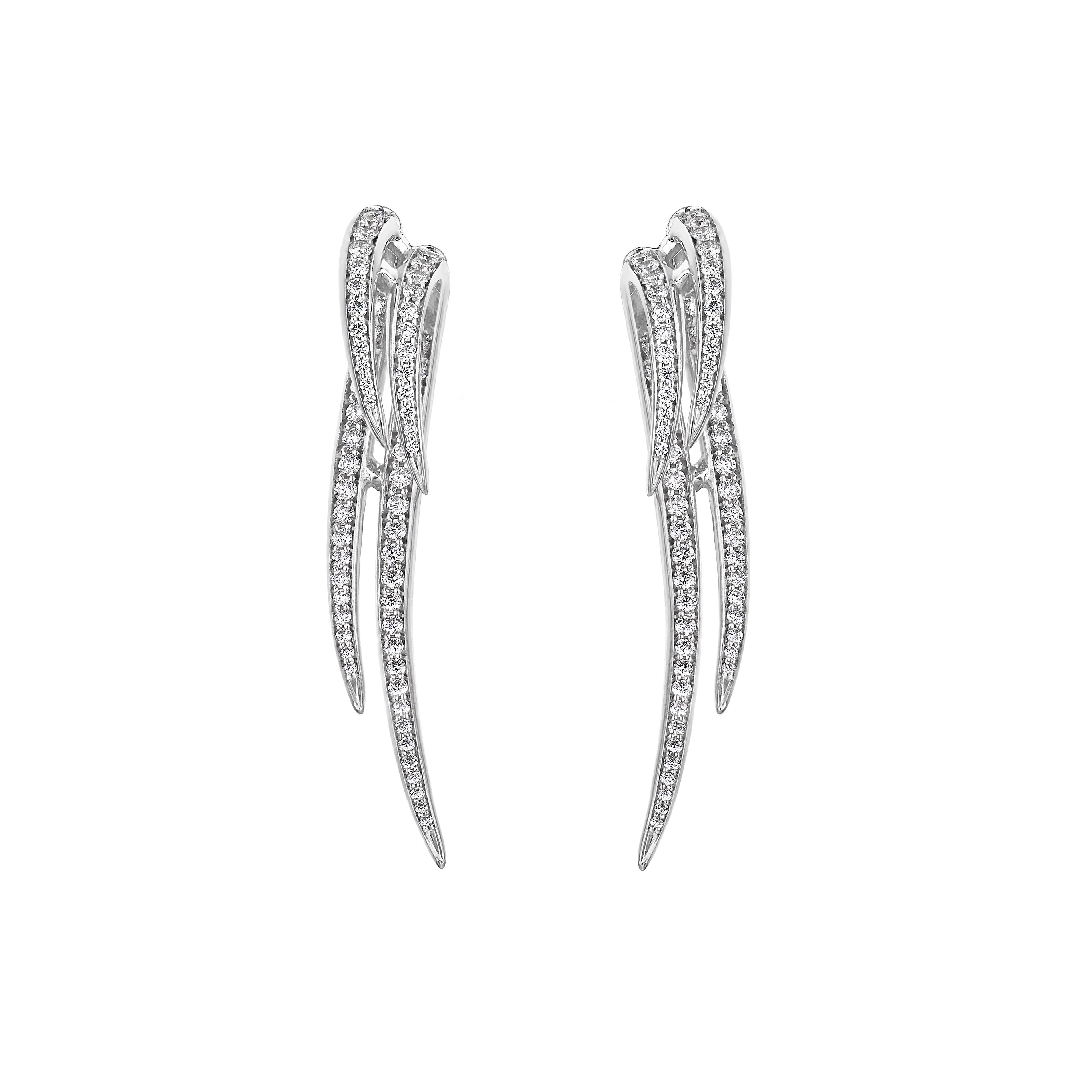 Crafted from 18ct white gold and 1.40cts of brilliant white diamonds, Armis Double Hook Earrings balance symmetry with perfect proportions. A waterfall of diamond pavé creates a sense of light and movement, framing the jawline beautifully. Infused