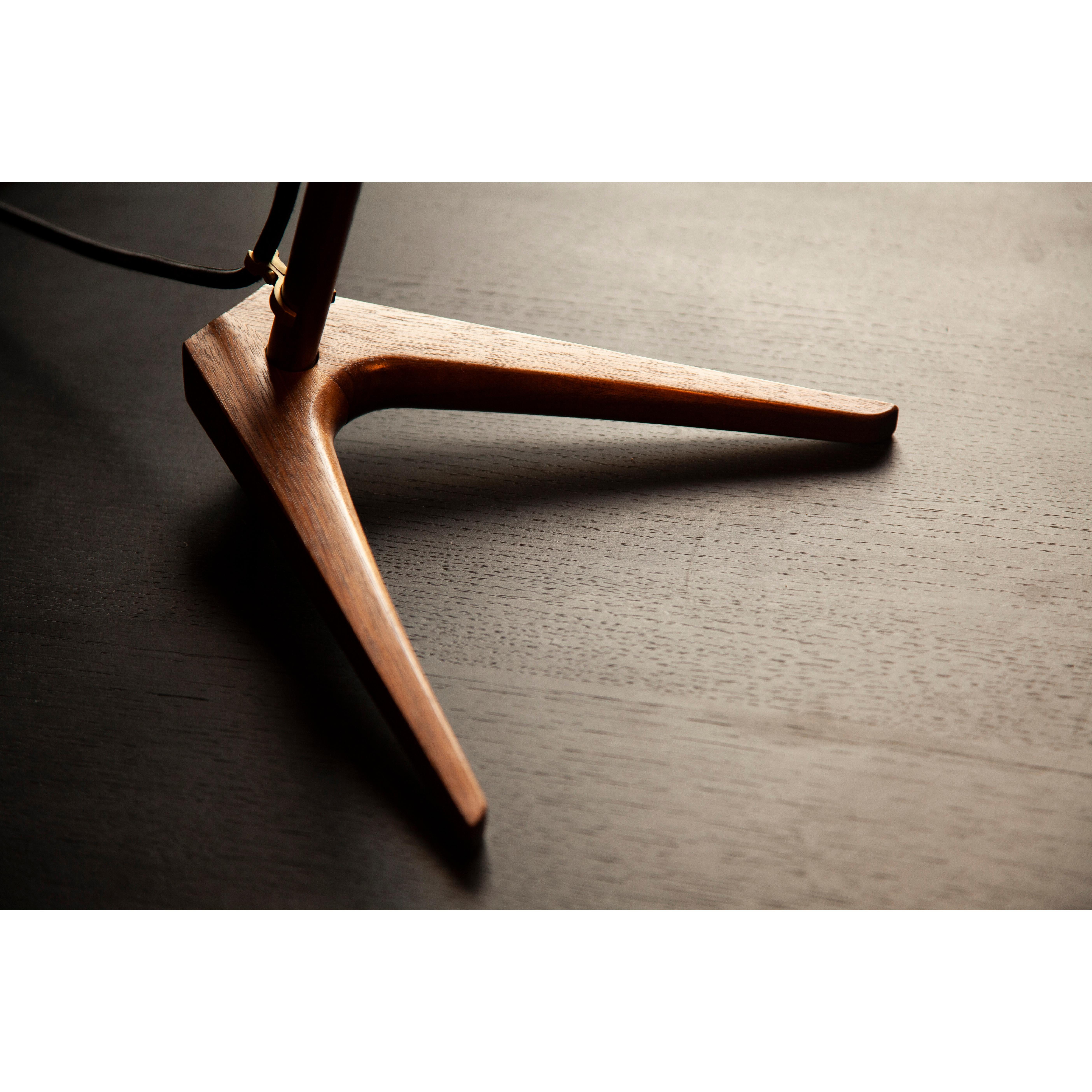 Heavily influenced by The Armitage Floor Lamp, our desk lamp shares the same DNA including a walnut structure with brushed brass detailing, the shade is sustainably sourced from a recycled water bottle felt laminate. 

Using warm to dim bulbs it