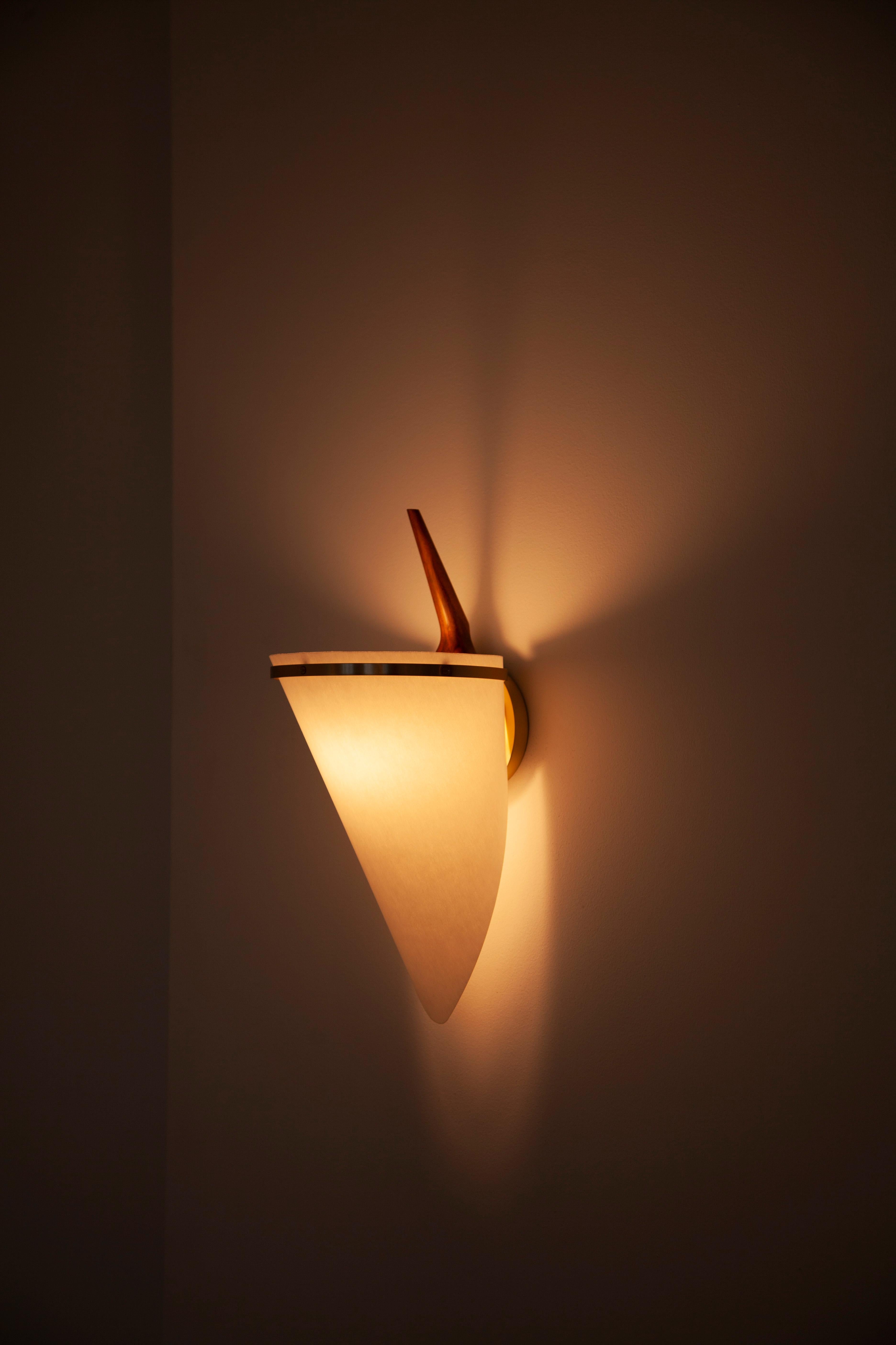 The Armitage Wall Lamp casts an orchid like light when placed on a wall and works well in both corridors or either side of a bed where it's been commonly used by our clients. 

The Armitage Floor Lamp originally designed in 1952 heavily influenced