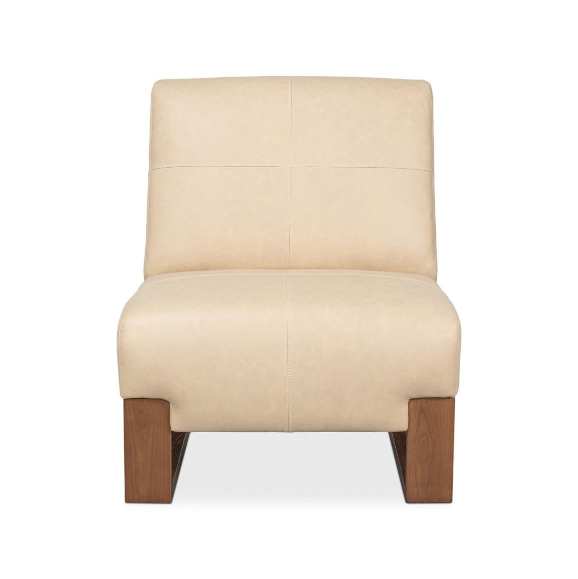 Expertly upholstered in cappuccino white top-grain cowhide, this accent chair features crisp quadrant stitching and a minimalist silhouette. The architectural oak sled base in medium brown creates a striking foundation while harmonizing with the