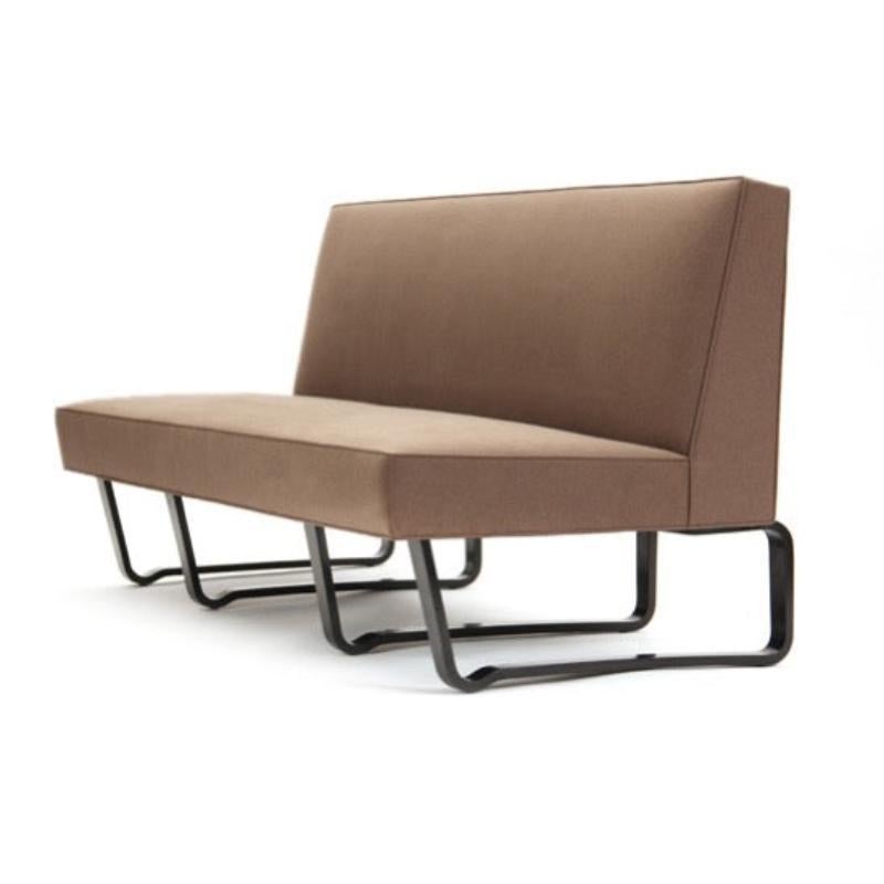 An armless sofa on laminated mahogany 