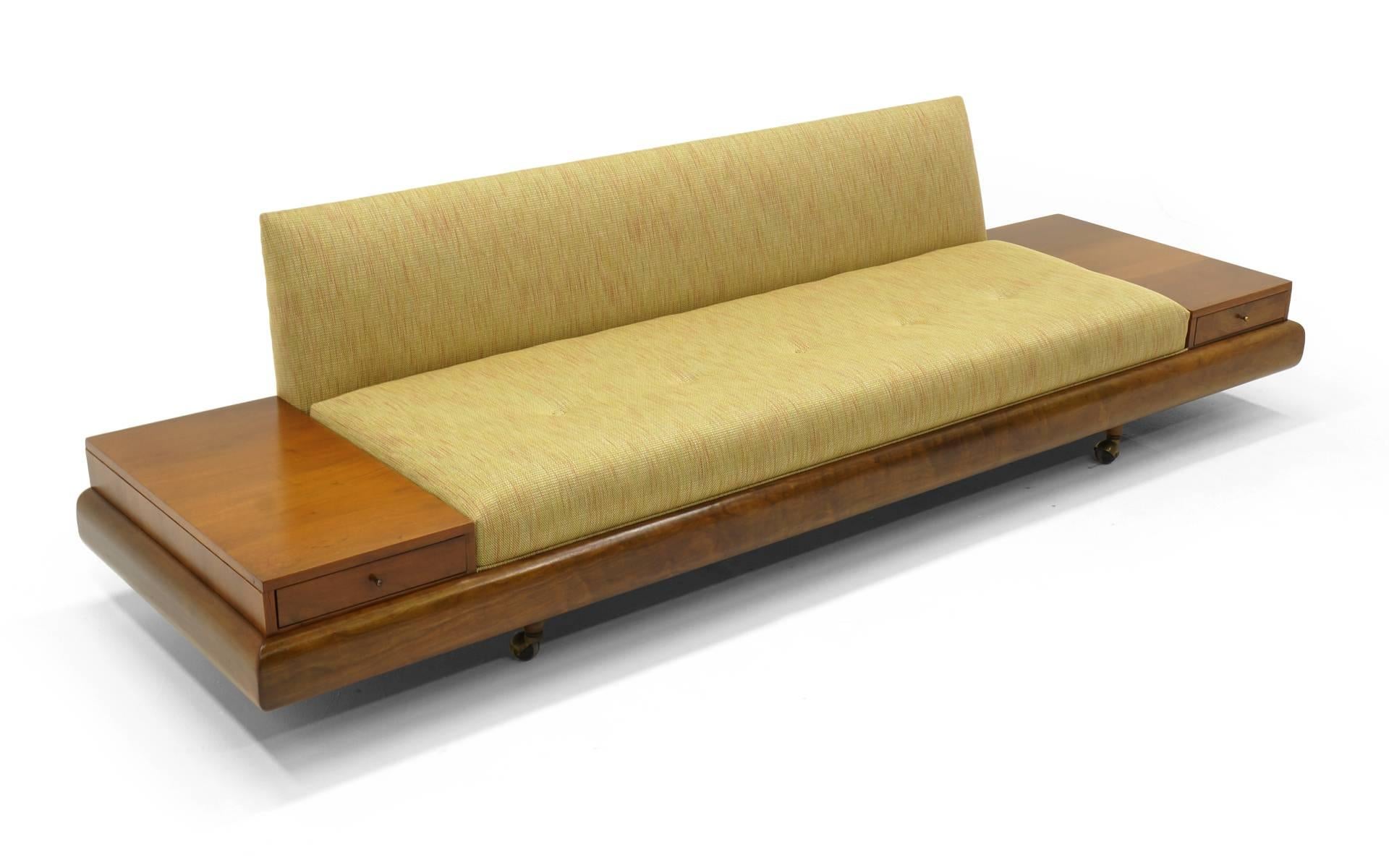 Adrian Pearsall for Craft Associates sofa with attached ends tables with drawers. New upholstery. Walnut trim and walnut attached tables. On casters, but those could be removed if so desired.