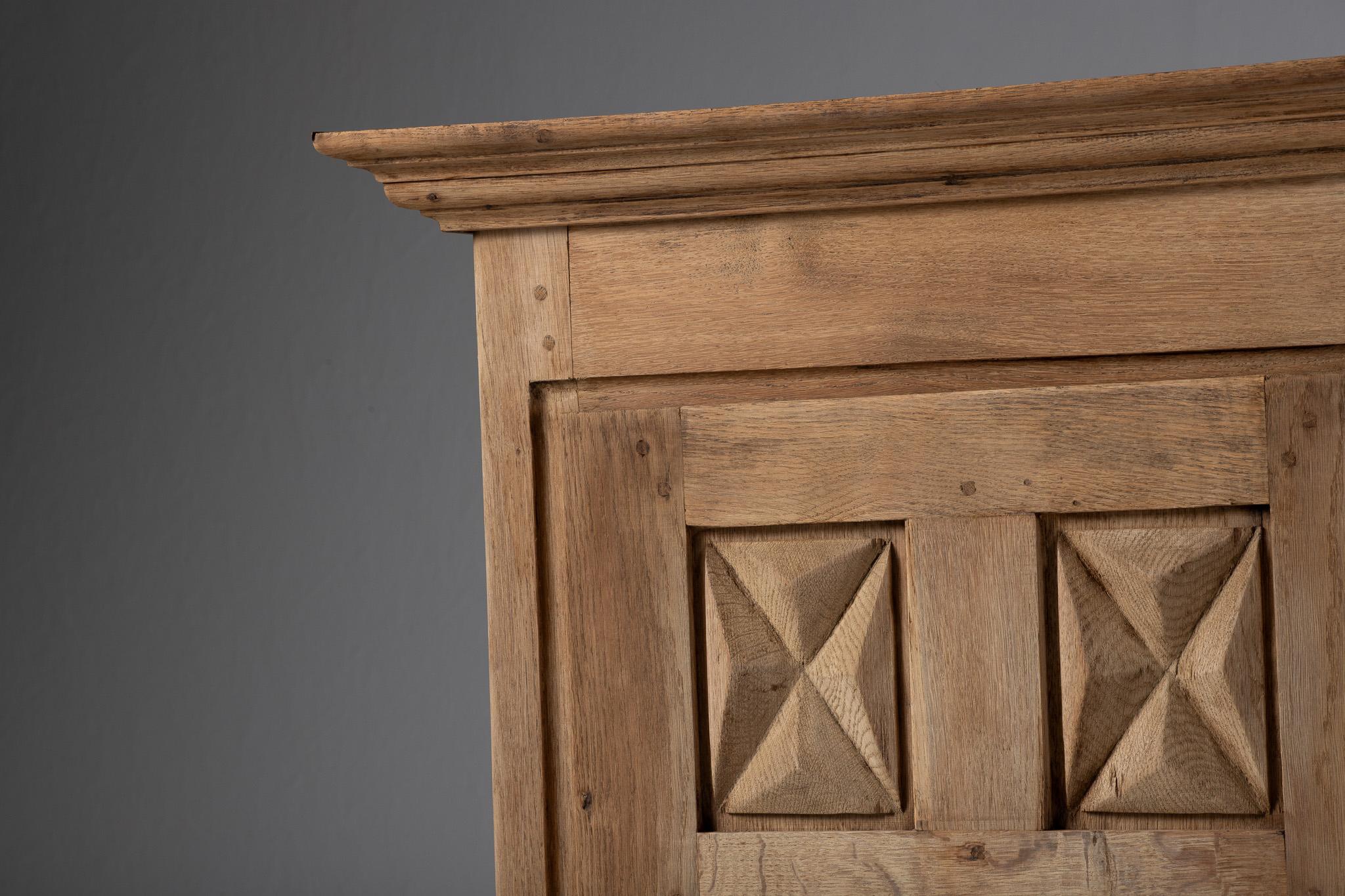 Armoire, Bleached Oak, France, circa 1940 
Echoing the Sculptural Language of French Provincial Modernism

Sculptural in stance and restrained in detail, this tall French cabinet from circa 1940 captures a moment of aesthetic transition—where