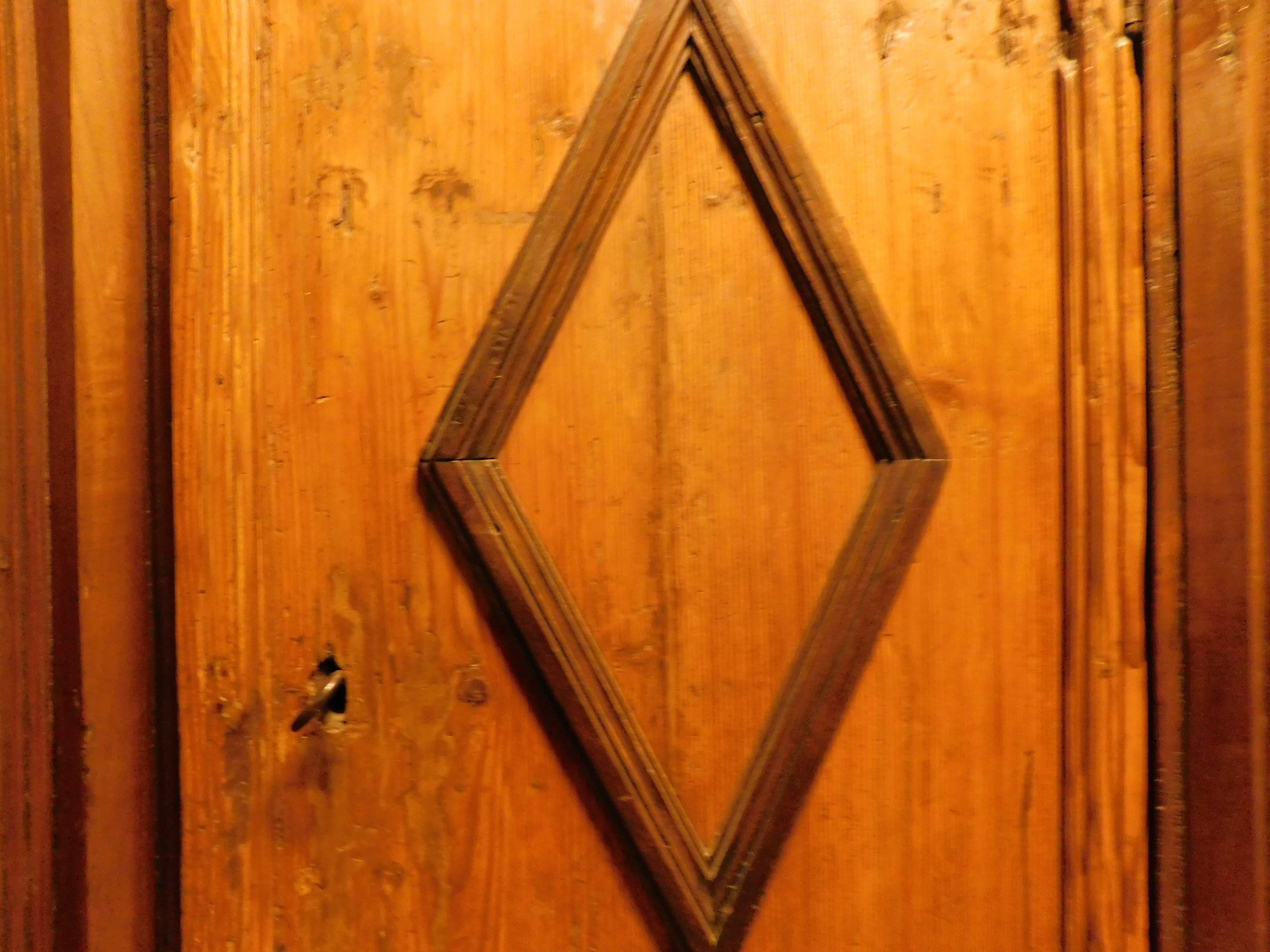 18th Century and Earlier Armoires wardrobe in larch wood with two doors with carved rhombuses, Italy For Sale