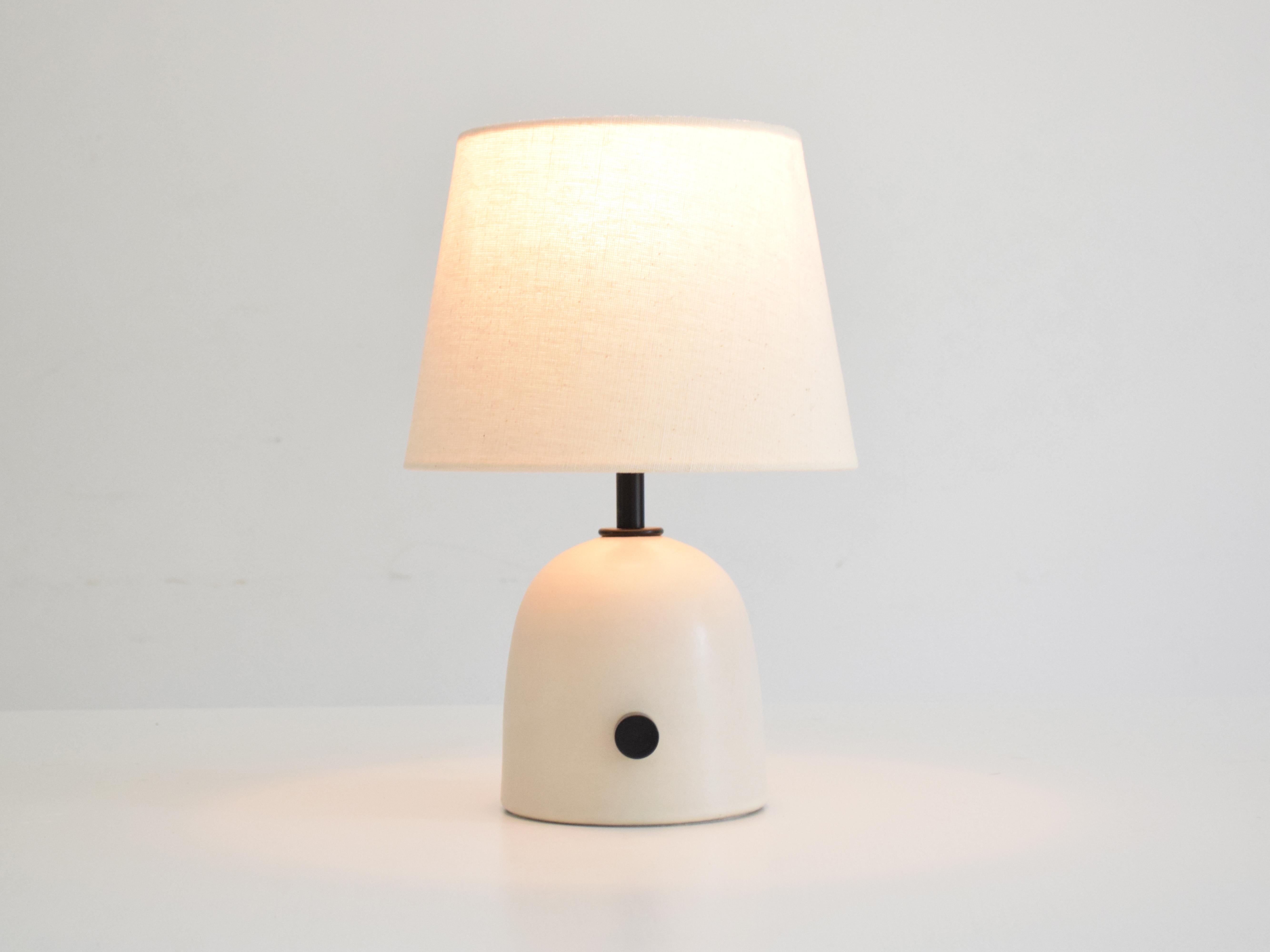 Brighten up your space with our handcrafted ceramic lamp glazed in off-white, with a rotary dimmer, entirely handcrafted in our studio.

You can turn the light on and off, decrease and increase the intensity, to make the environment more