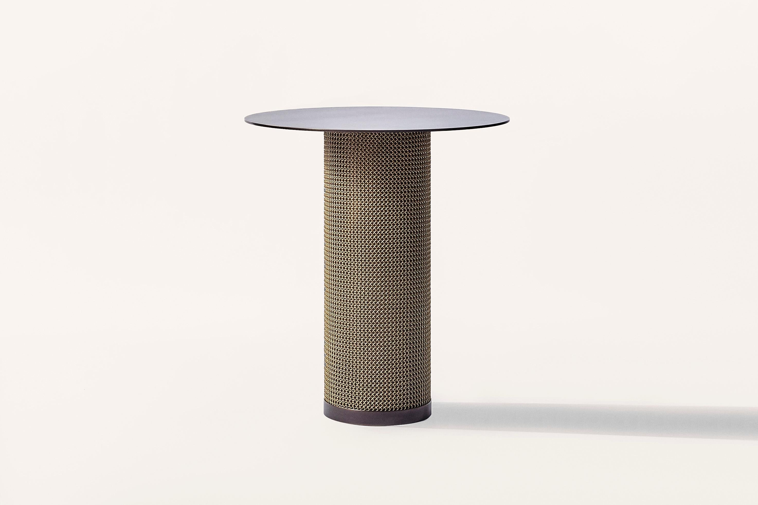 Part of the Armor Collection, the Armor Side Table is inspired by the intricate use of chainmail in Medieval armor. This table features a cold-rolled steel table cloaked with finished stainless steel chainmail, and is available with a cylinder or
